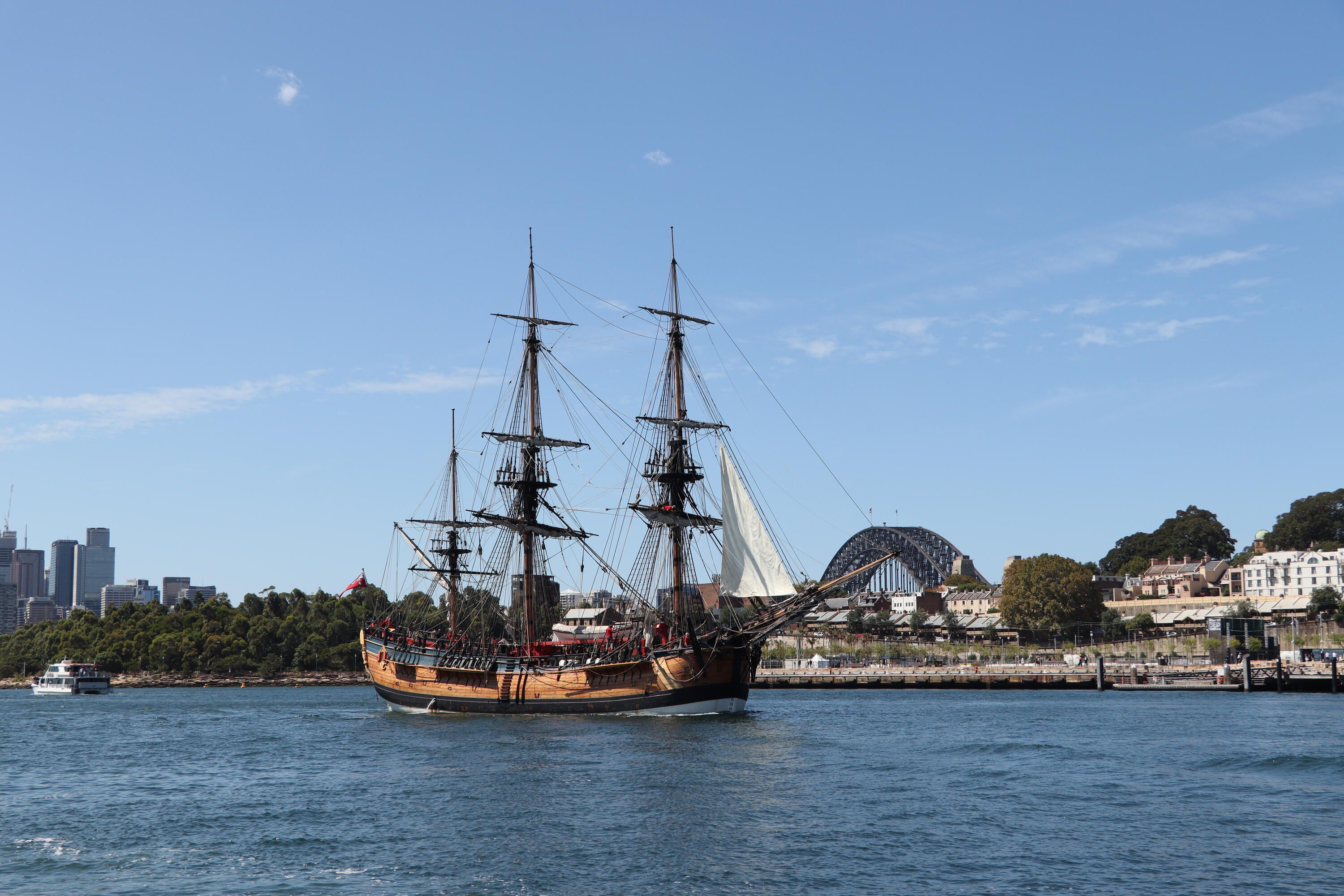 Photo taken of a tall ship, Endeavour, on Sydney Harbour. Thy Sydney Harbour bridge can just be seen in the background.