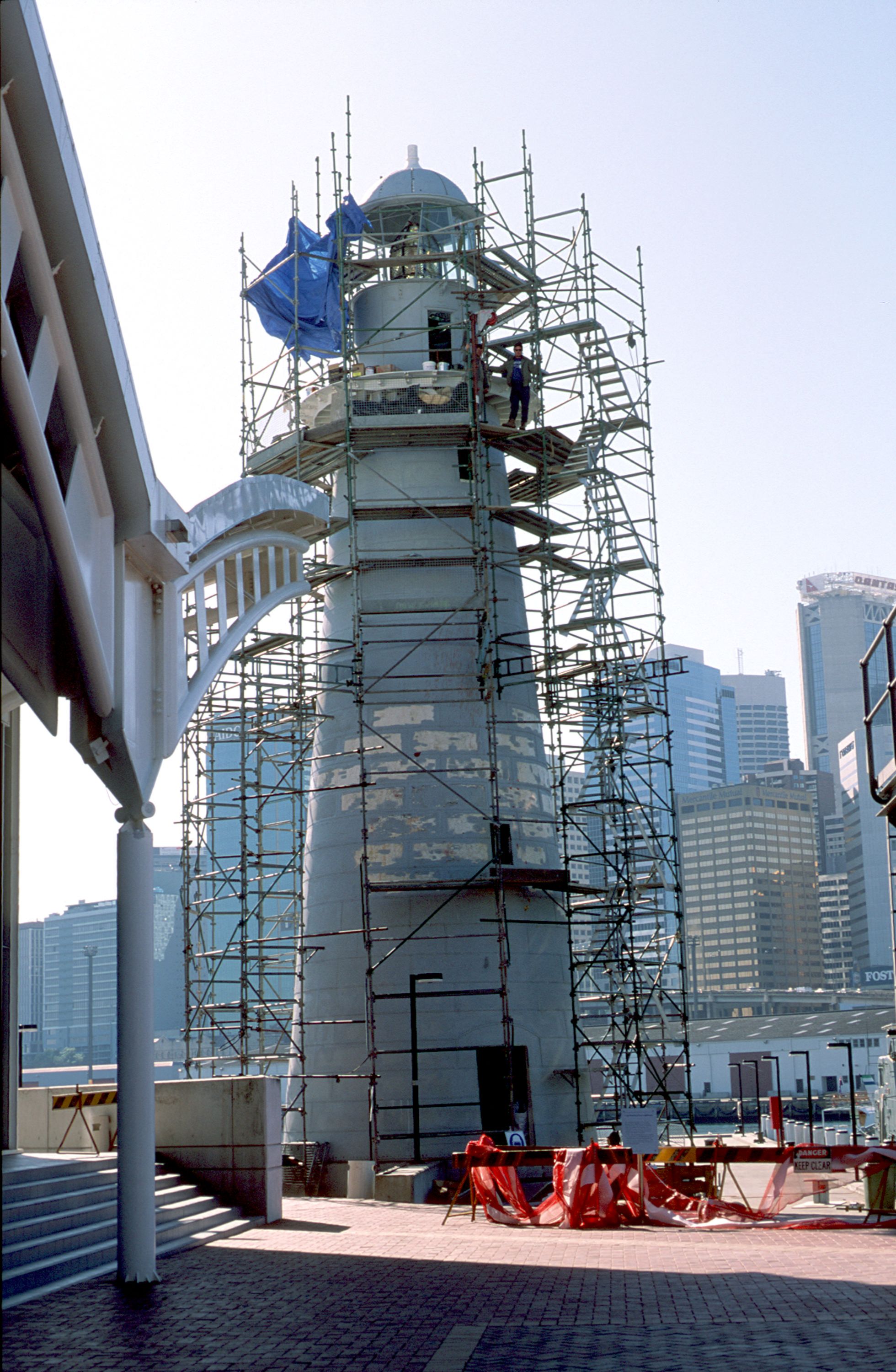 Photo of a lighthouse surrounded by scaffolding