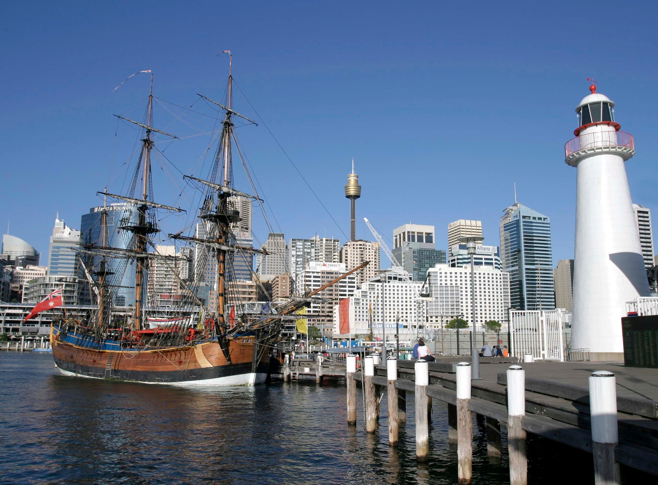 Endeavour at the museum with lighthouse to the right and the city in the background. 