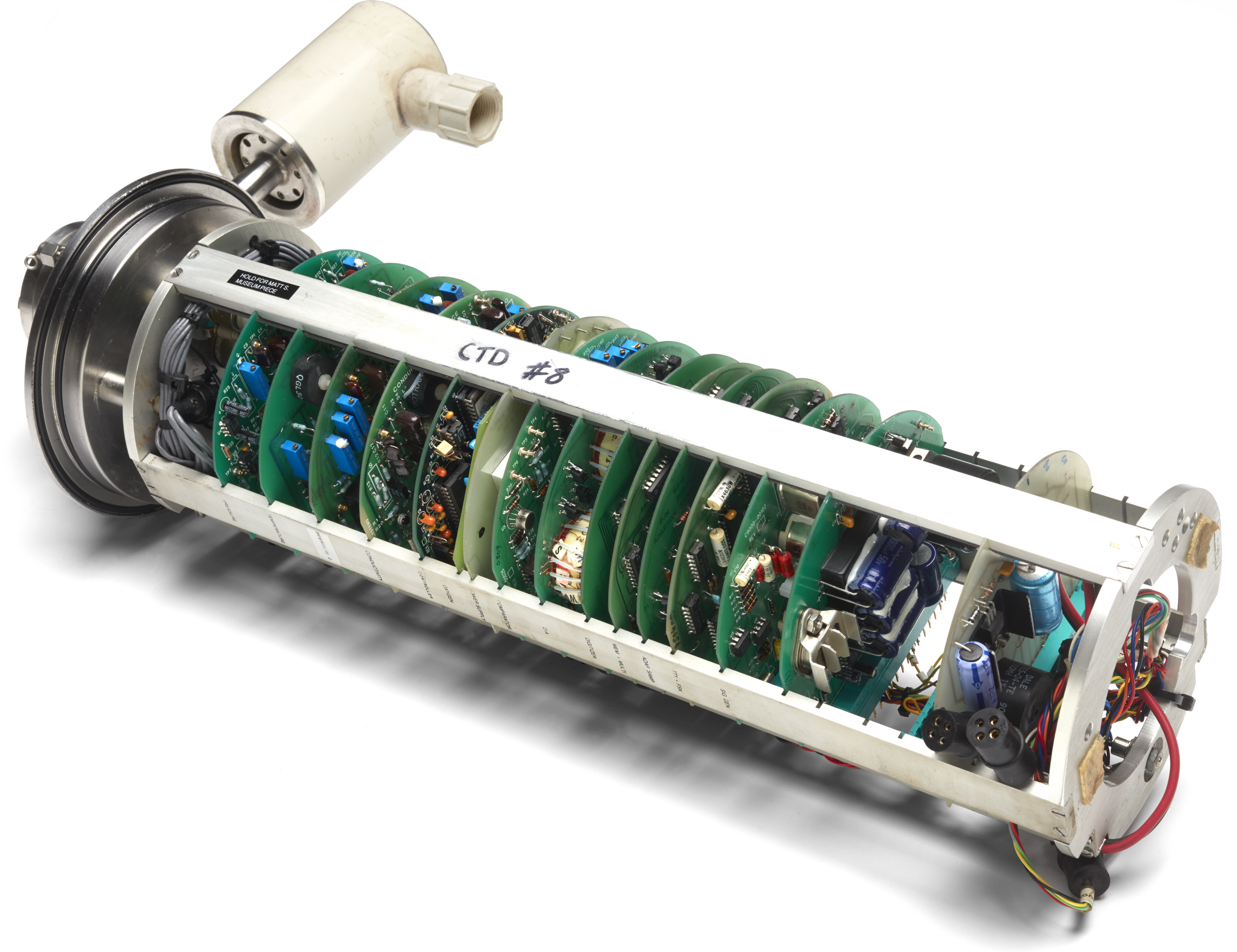 A photo of a scientific instrument with the internal electronics exposed.