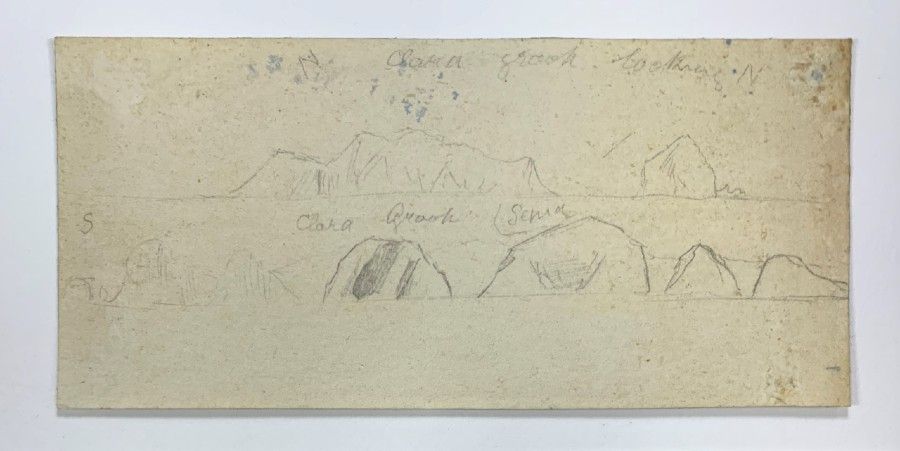 Photo showing a rectangular piece of paper with feint pencil drawings.