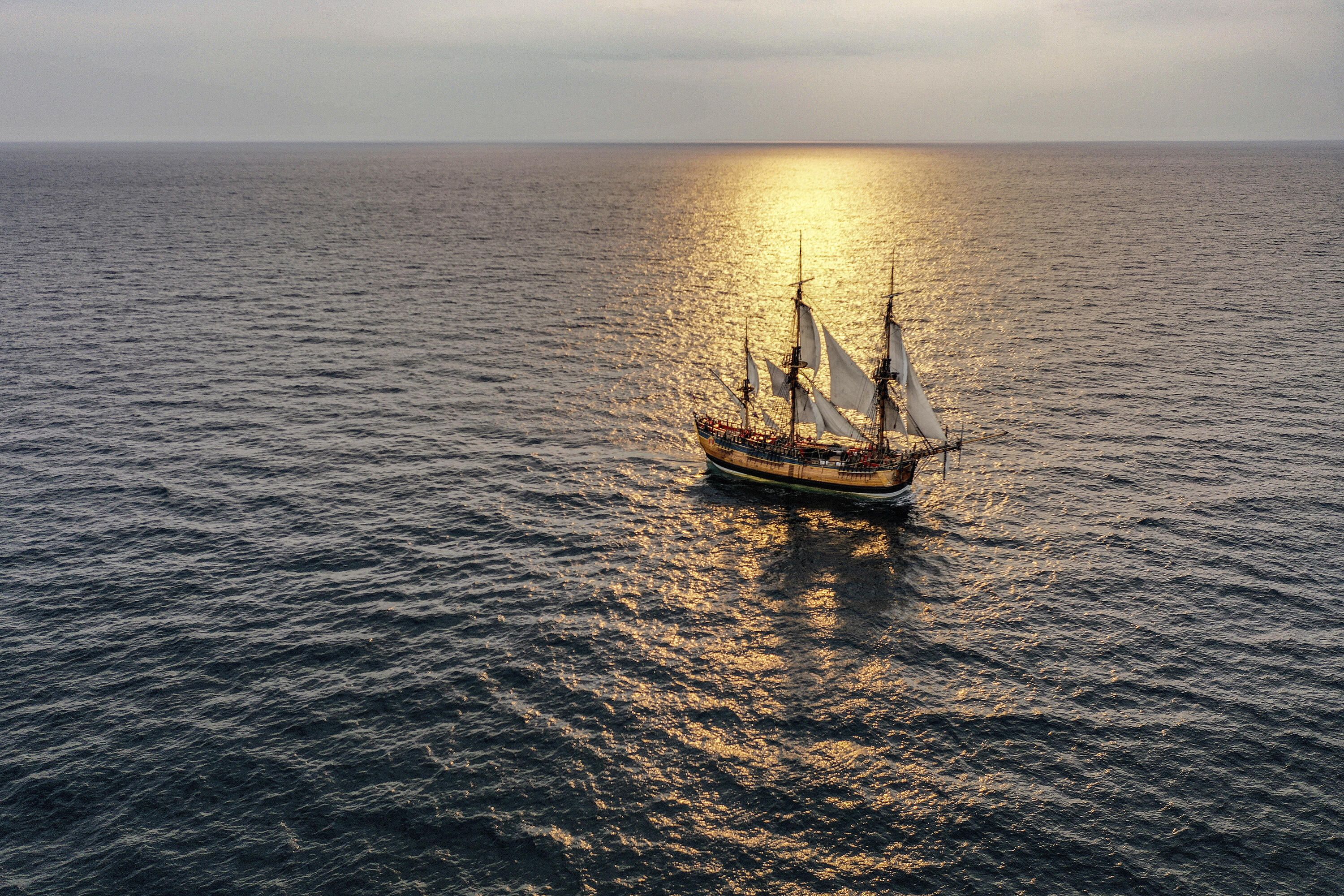 Aerial photograph of a tall ship at sea. 