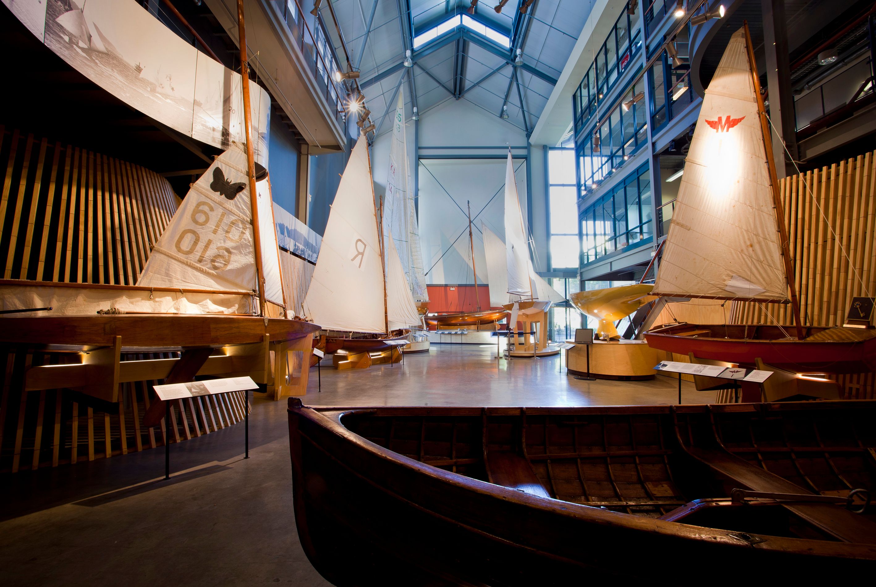 Interior views of the Wharf 7 building foyer including small wooden sailing boats.