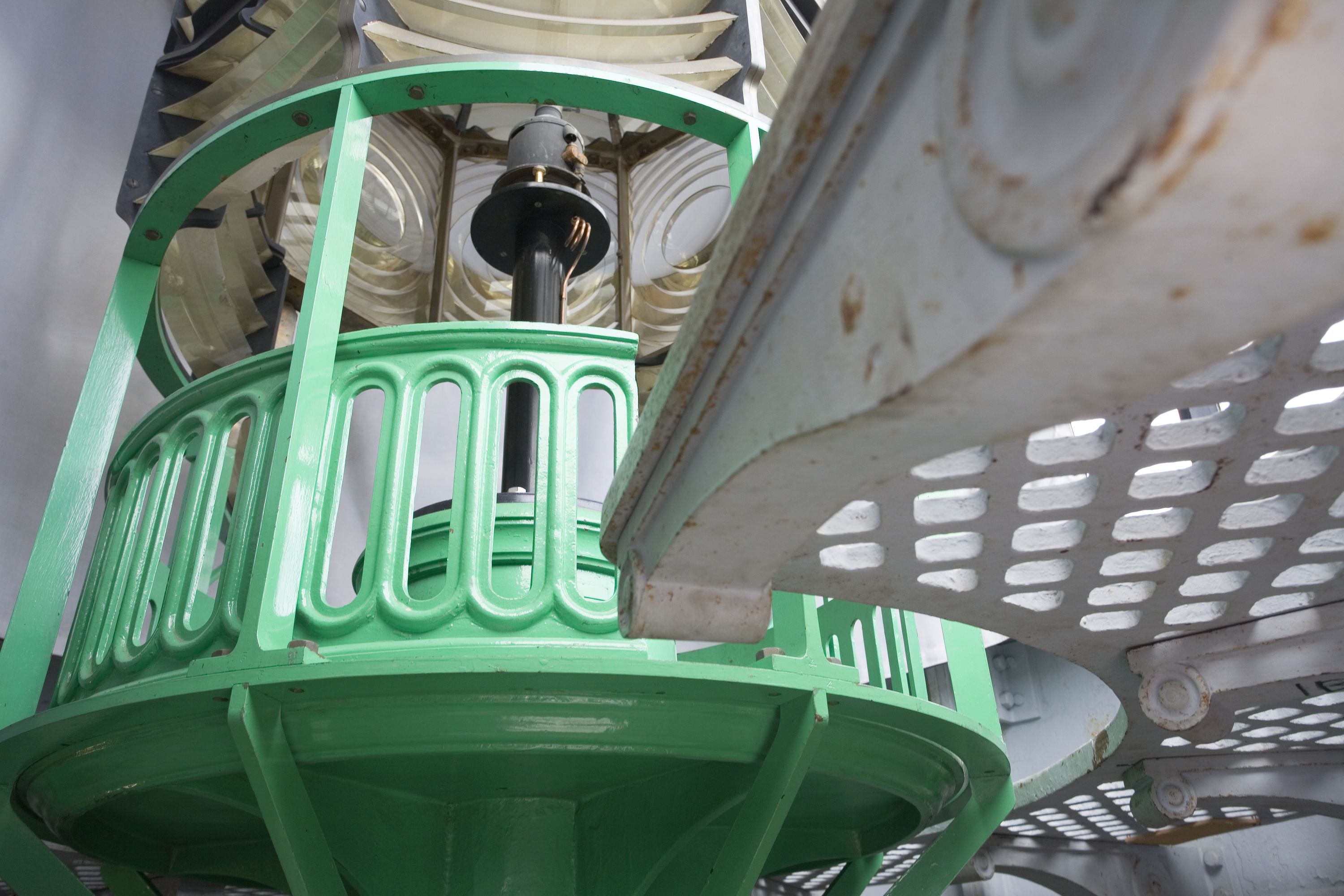 Detail of the lighthouse lantern lenses and green painted iron work.