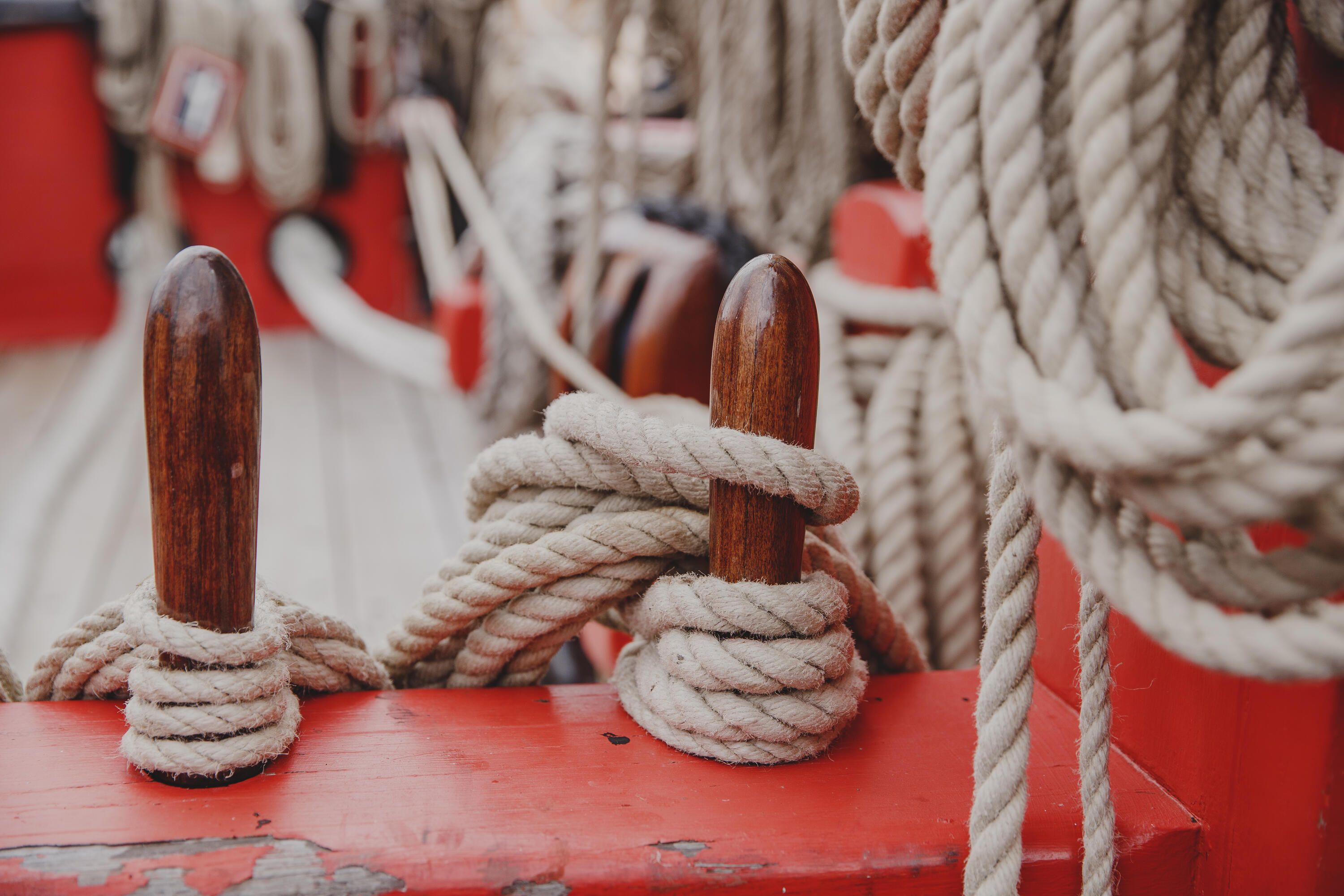 Close up photo showing detail of ropes on a wooden tall ship.