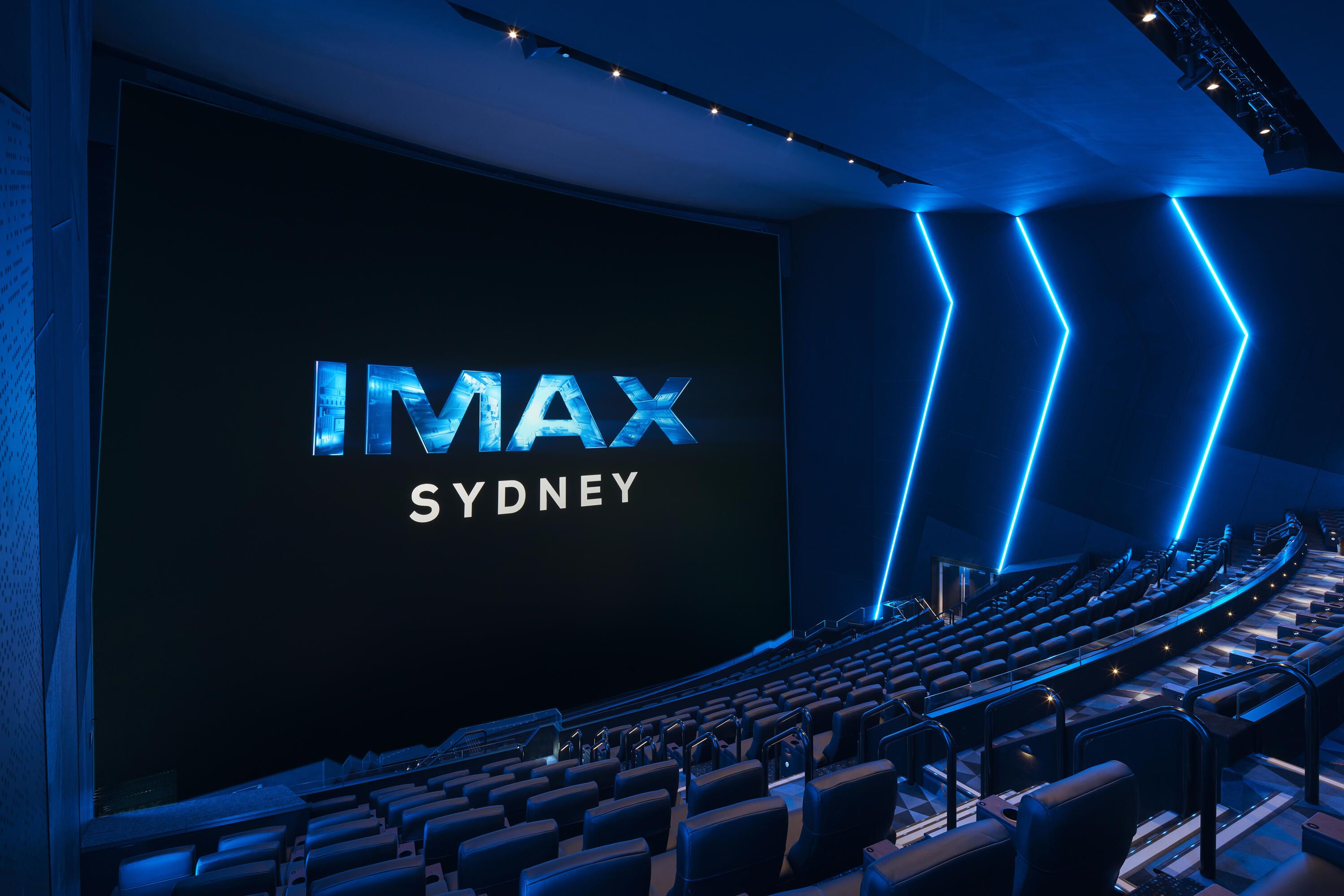 Logo for IMAX Sydney on a dark screen in a dark theatre