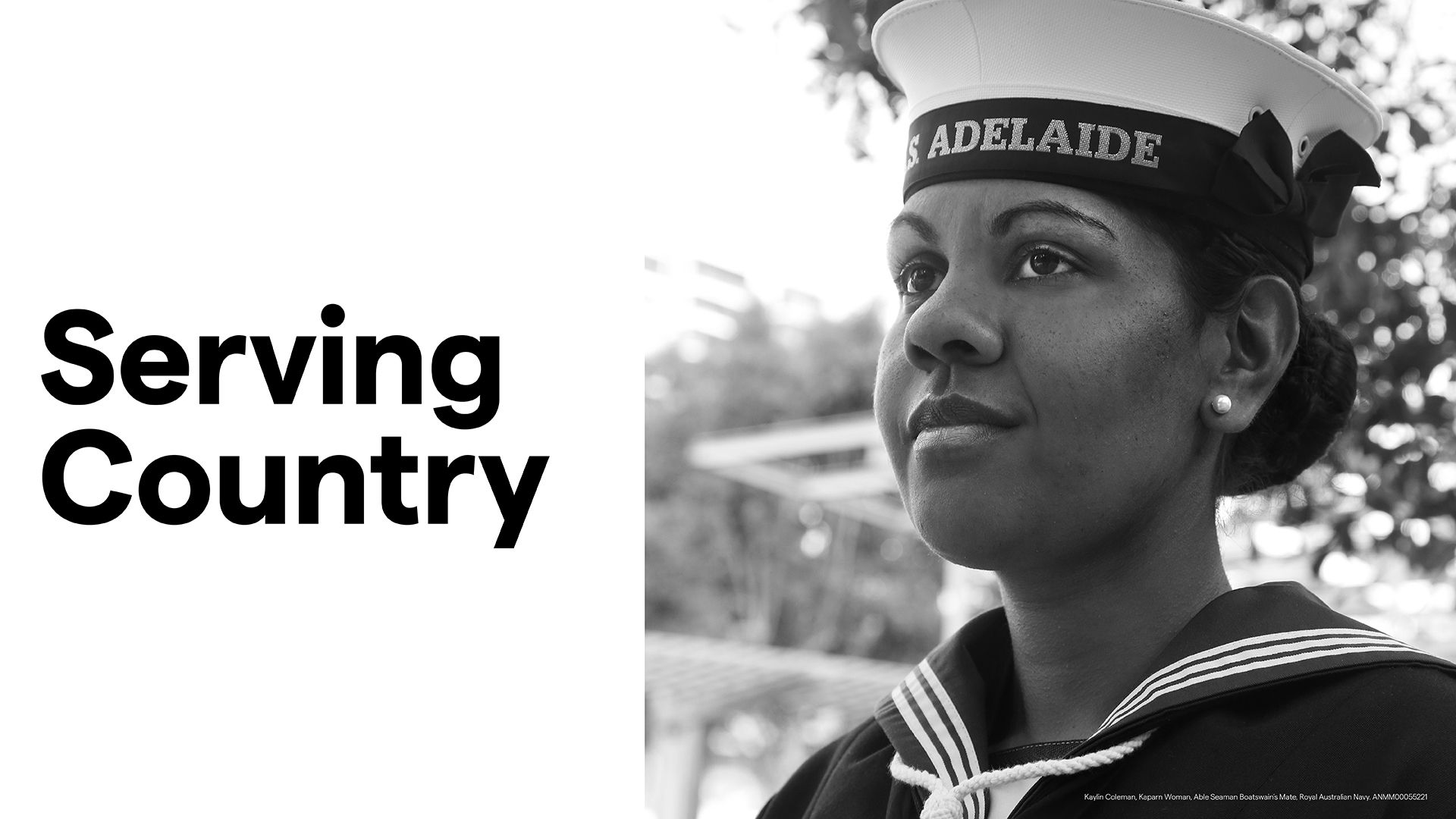 Banner with the title Serving Country and a black and white photo of a dark skinned woman wearing a formal navy uniform. 