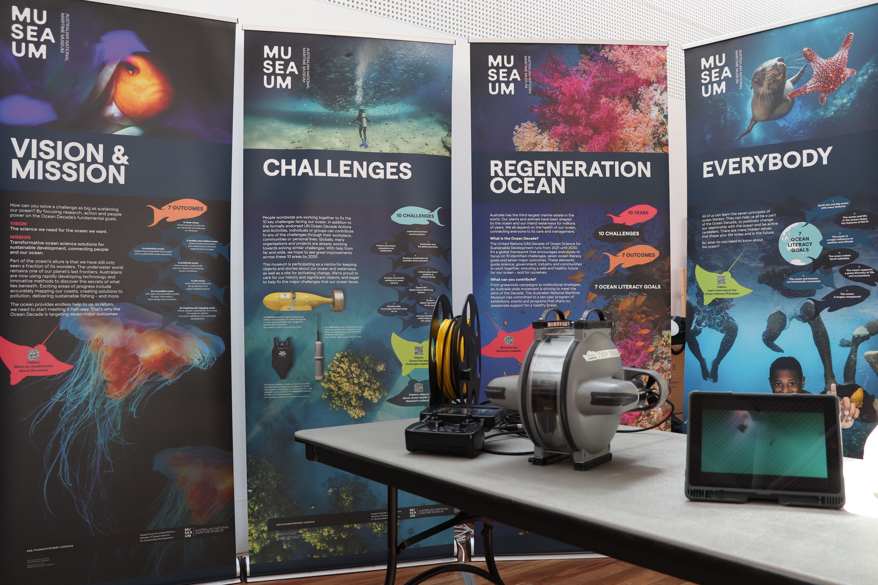 Photo showing 4 banners with images and text about Ocean Science