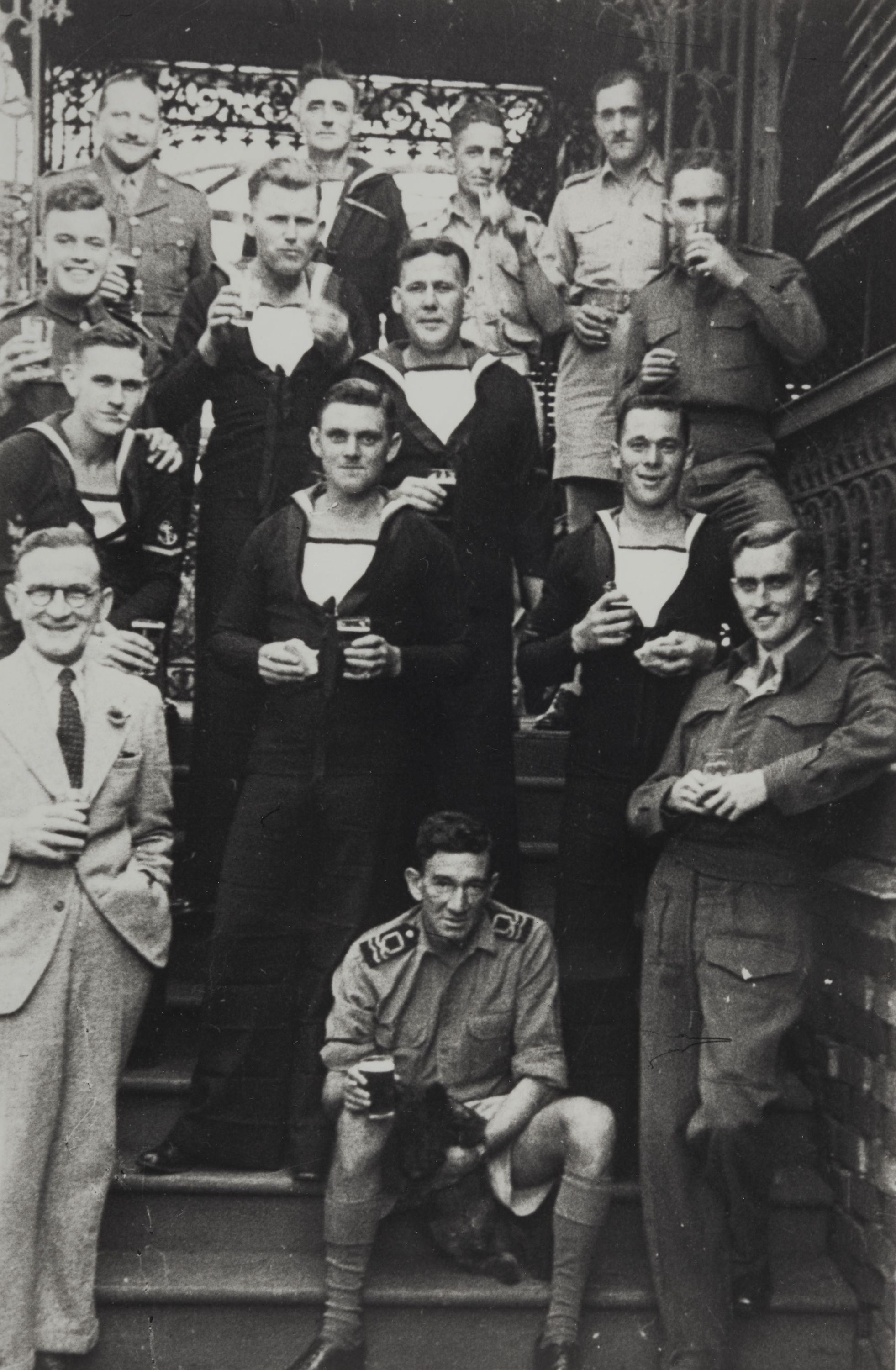 Black and white photo of a group of men in various military uniforms.