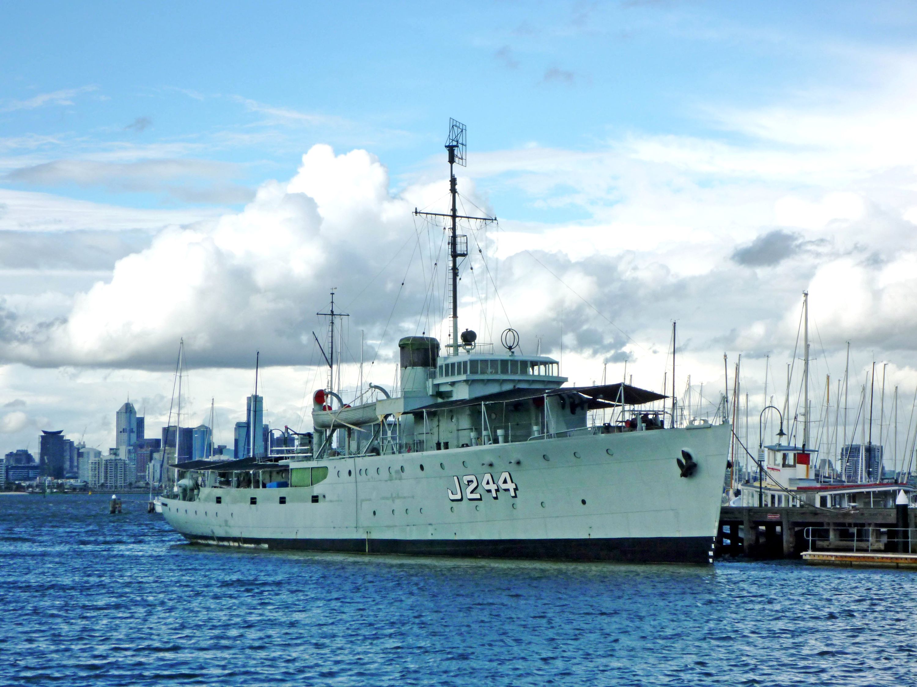 Colour photograph showing a navy ship