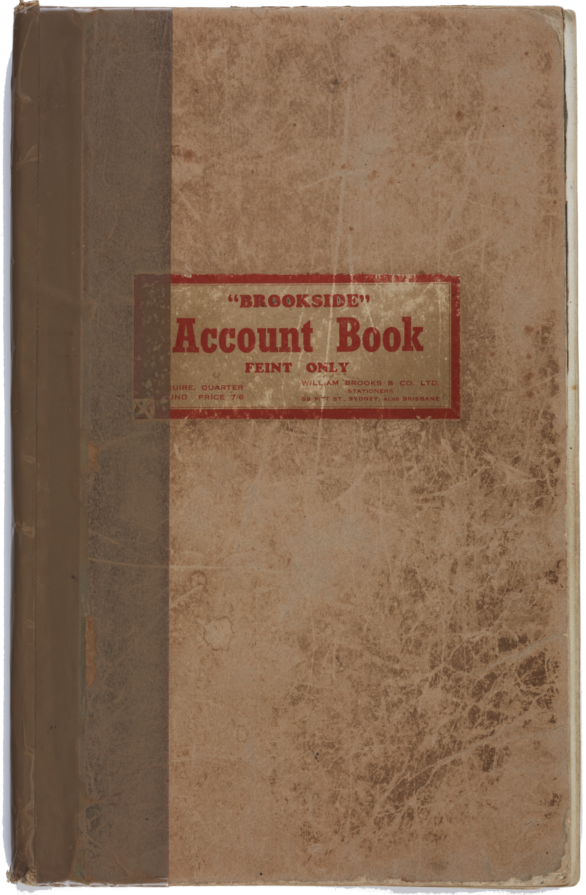 Light brown cover with "Account Book" in red text. The book is old and worn.  