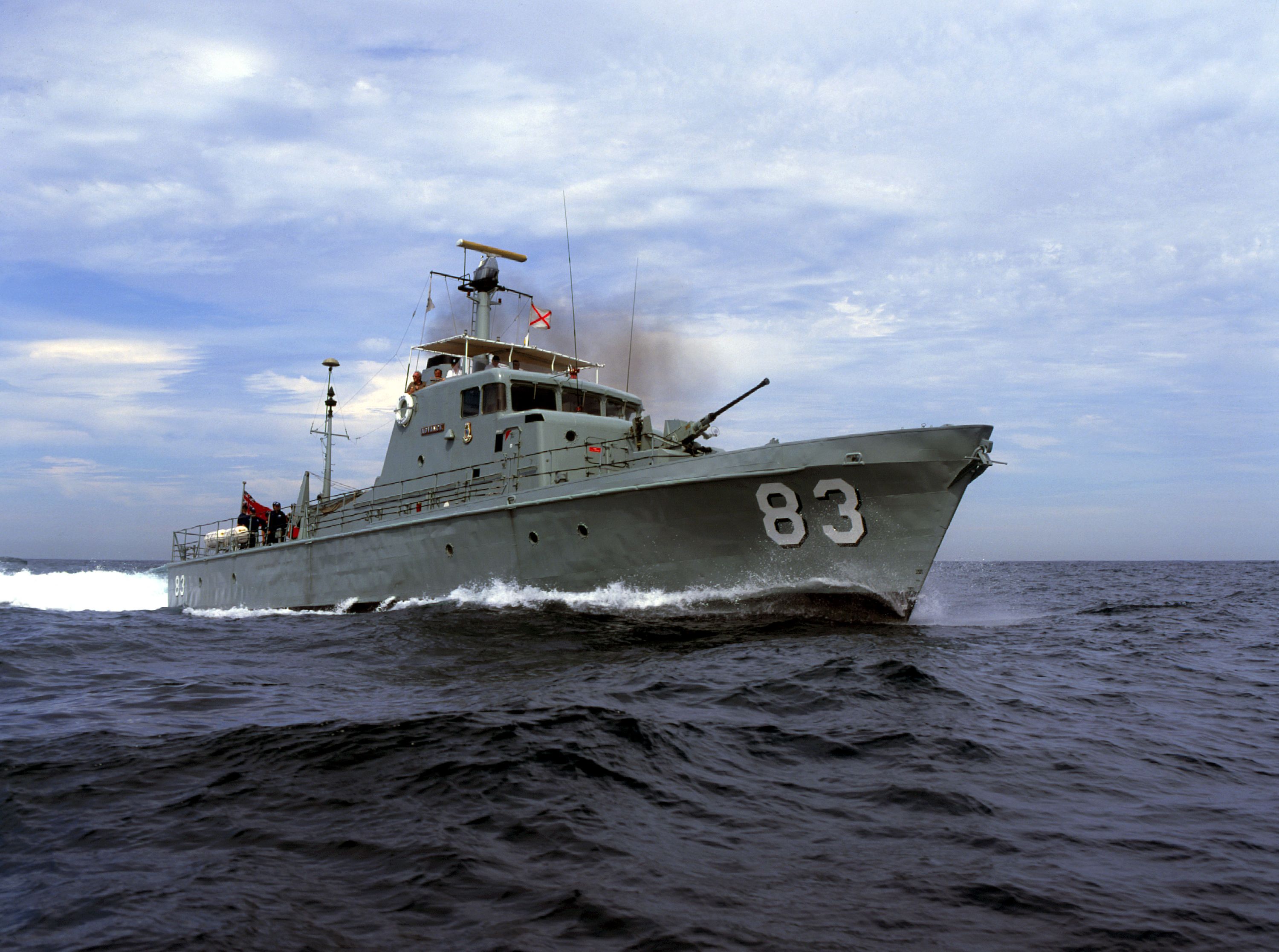 Photo of a small, navy patrol boat at sea. 