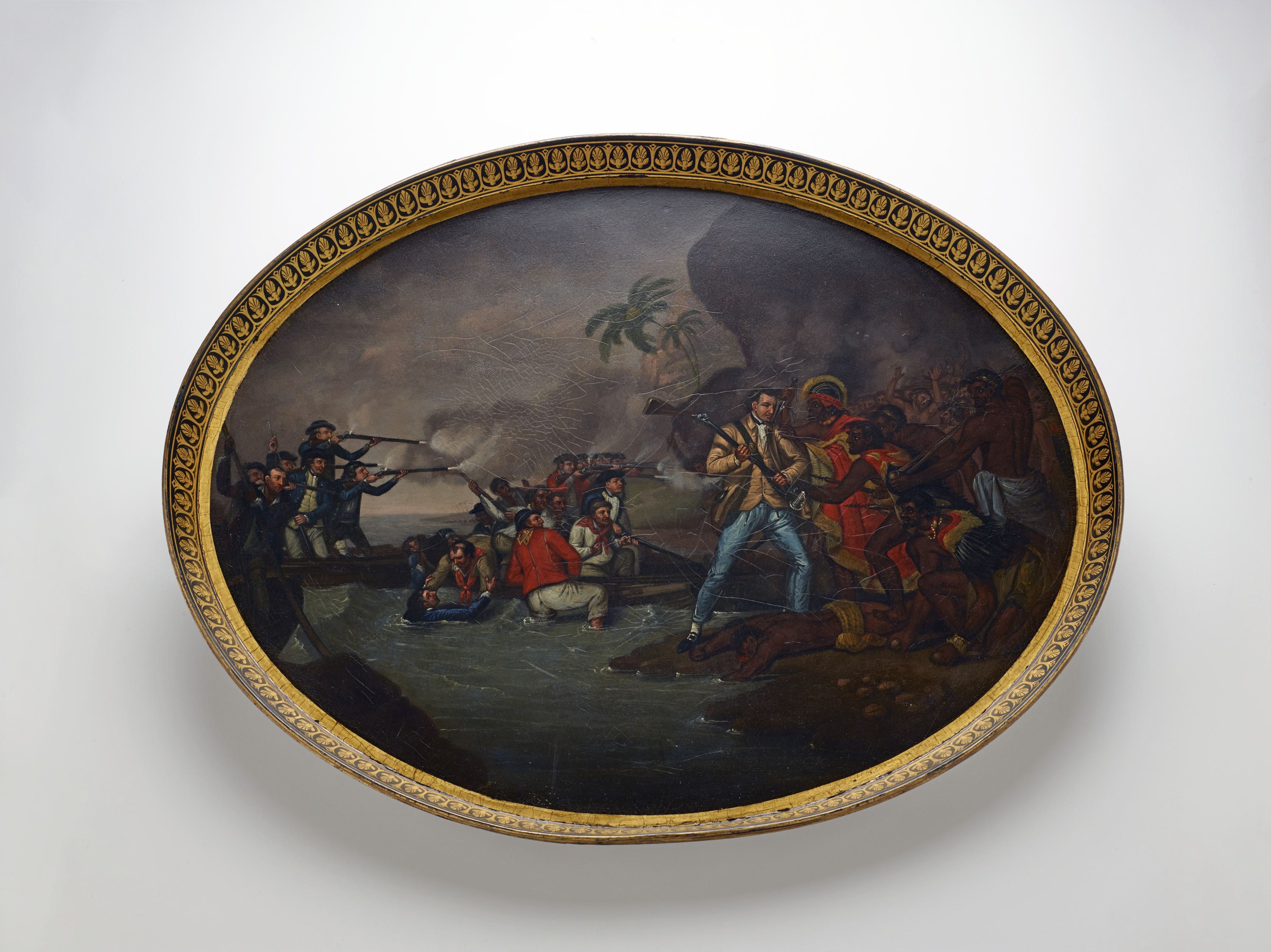 Photo of an oval tray with a gold boarder and a a painting that depicts a scene of the death of Captain Cook.