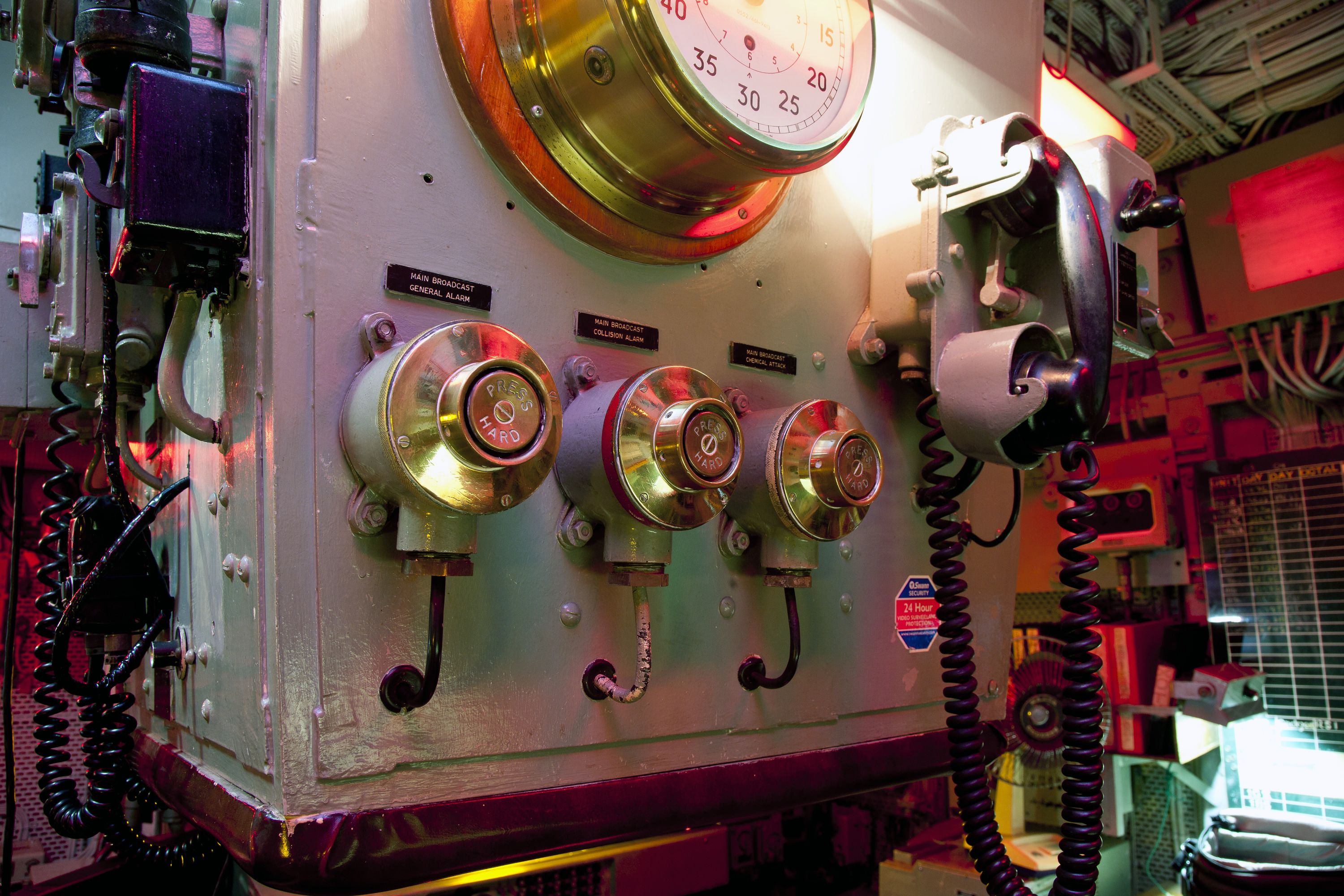 Photo showing a close up of a phone and alarms onboard a navy ship.