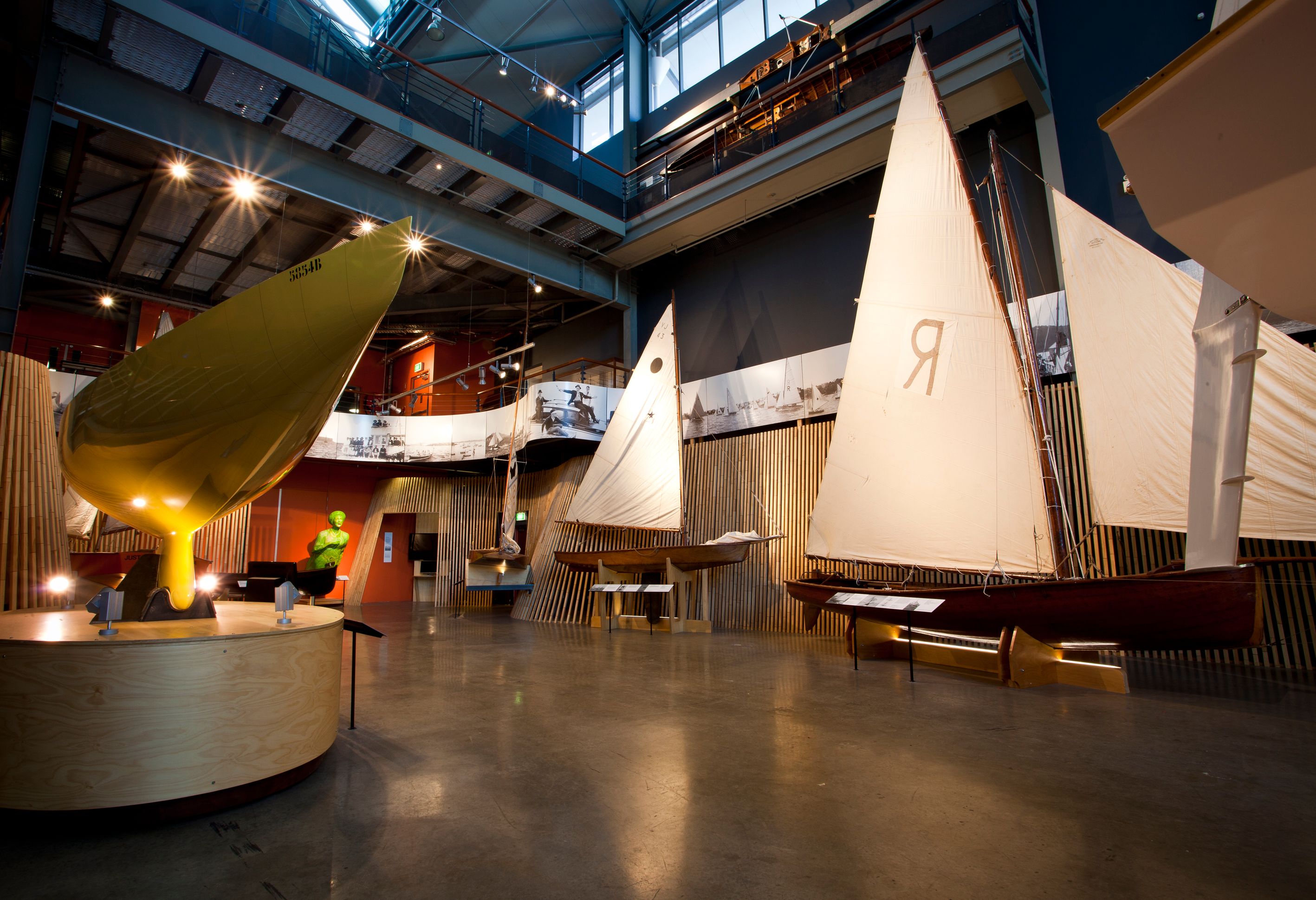 Interior views of the Wharf 7 building foyer including small wooden sailing boats.