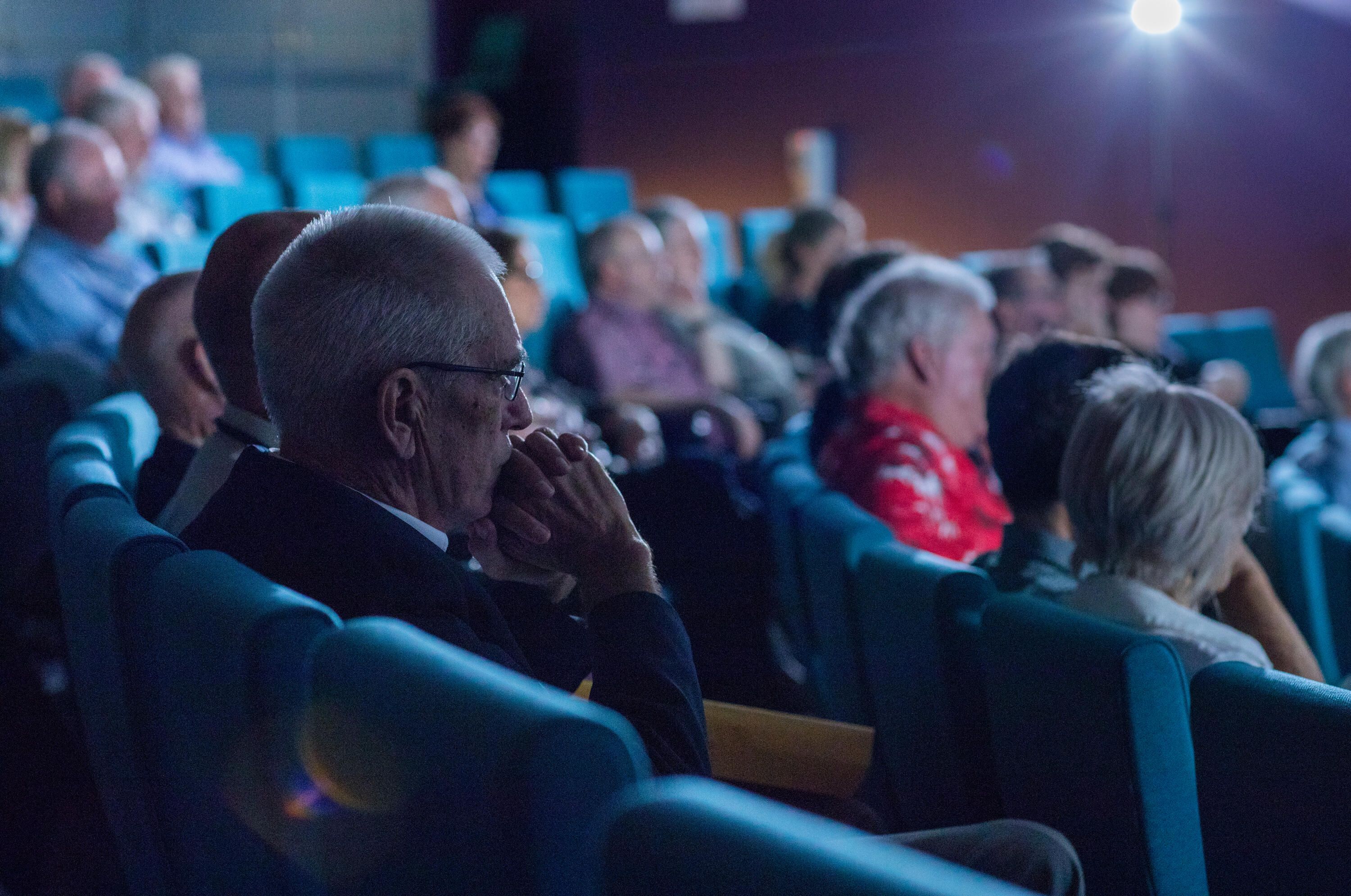 Audience of event guests seated in the theatre