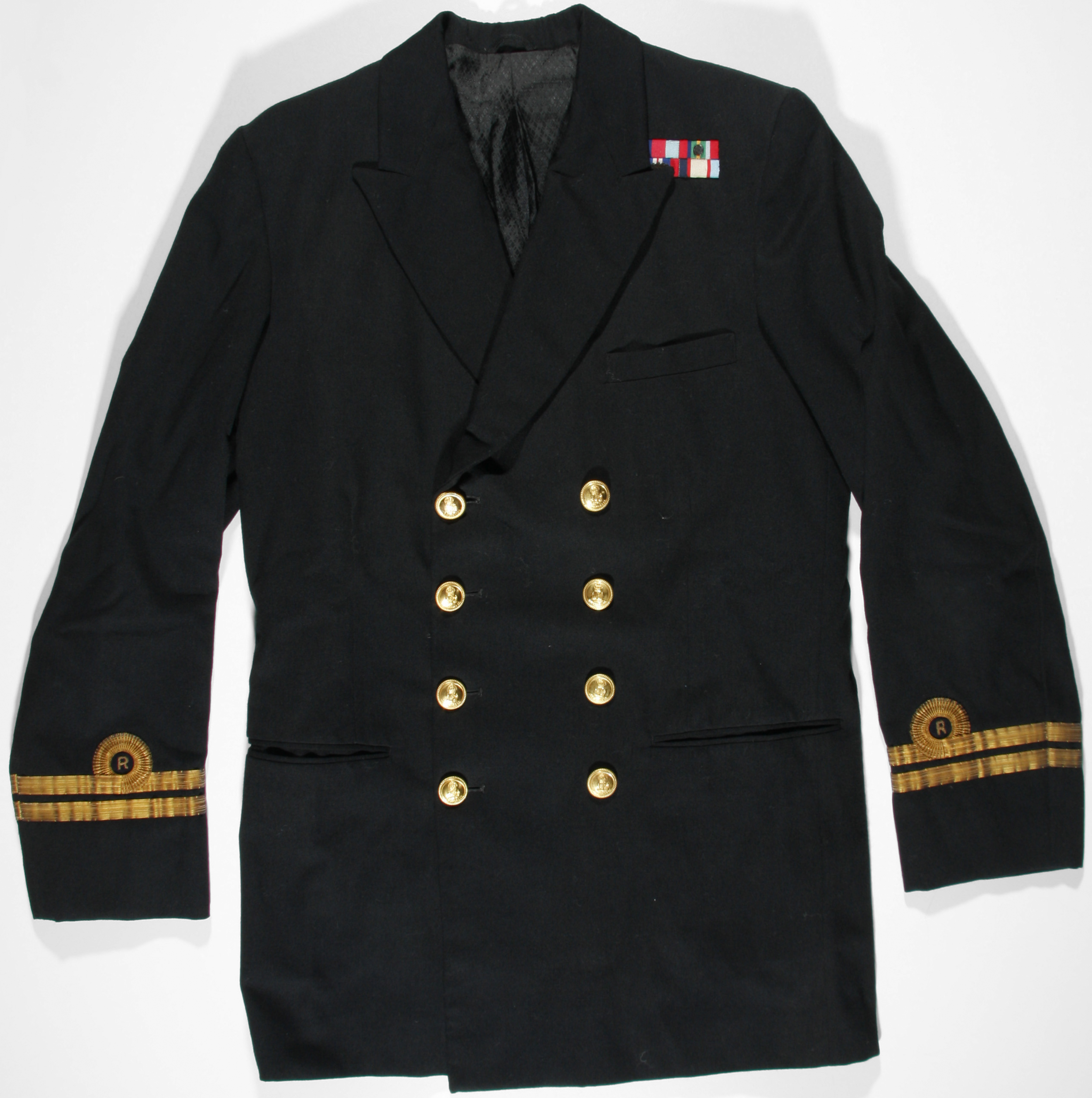 A black milirary jacket with gold buttons and decoration around the cuffs. There are small medal ribbon on the collar. 