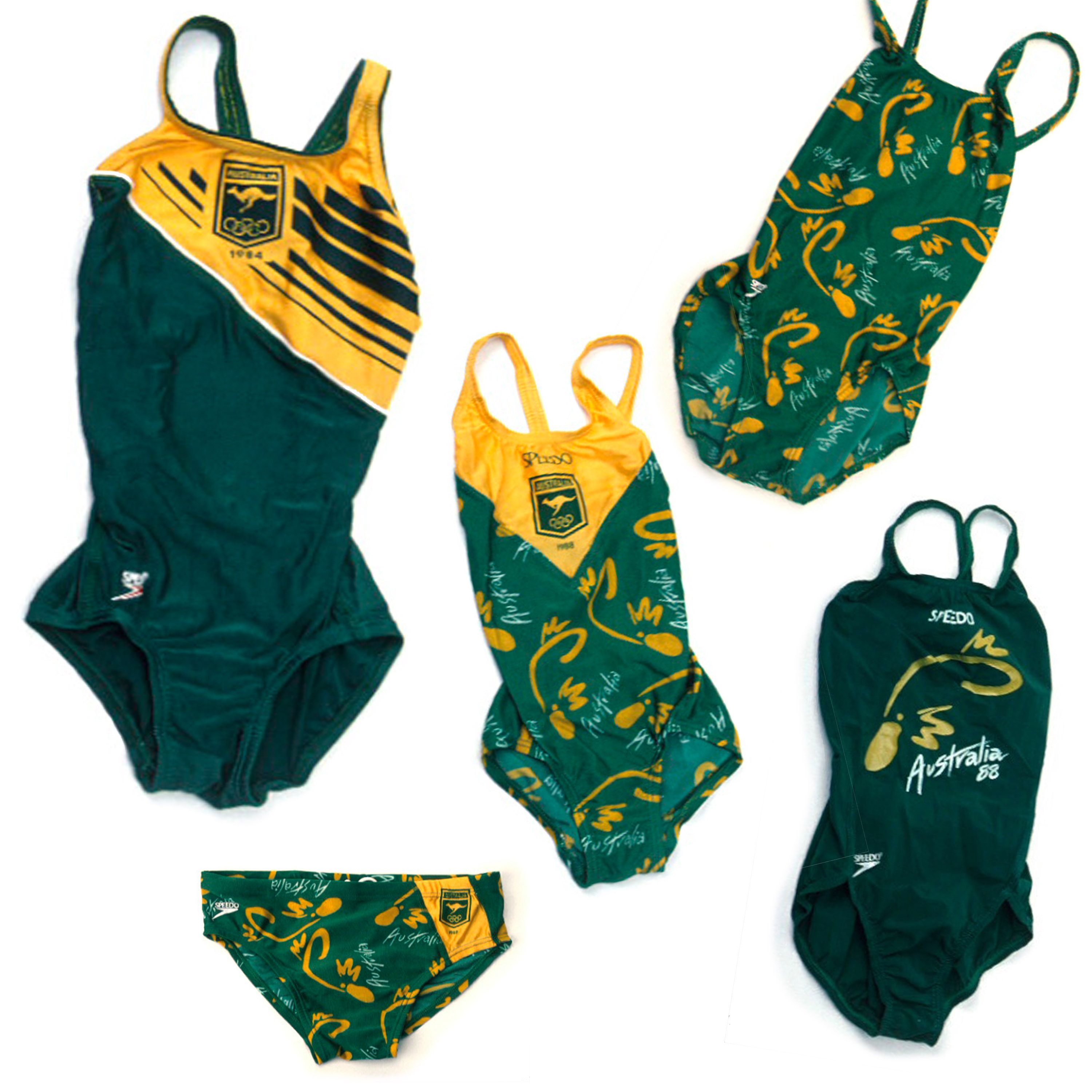 5 peices of green and gold swimwear with australian crests. Some with a platypus pattern.