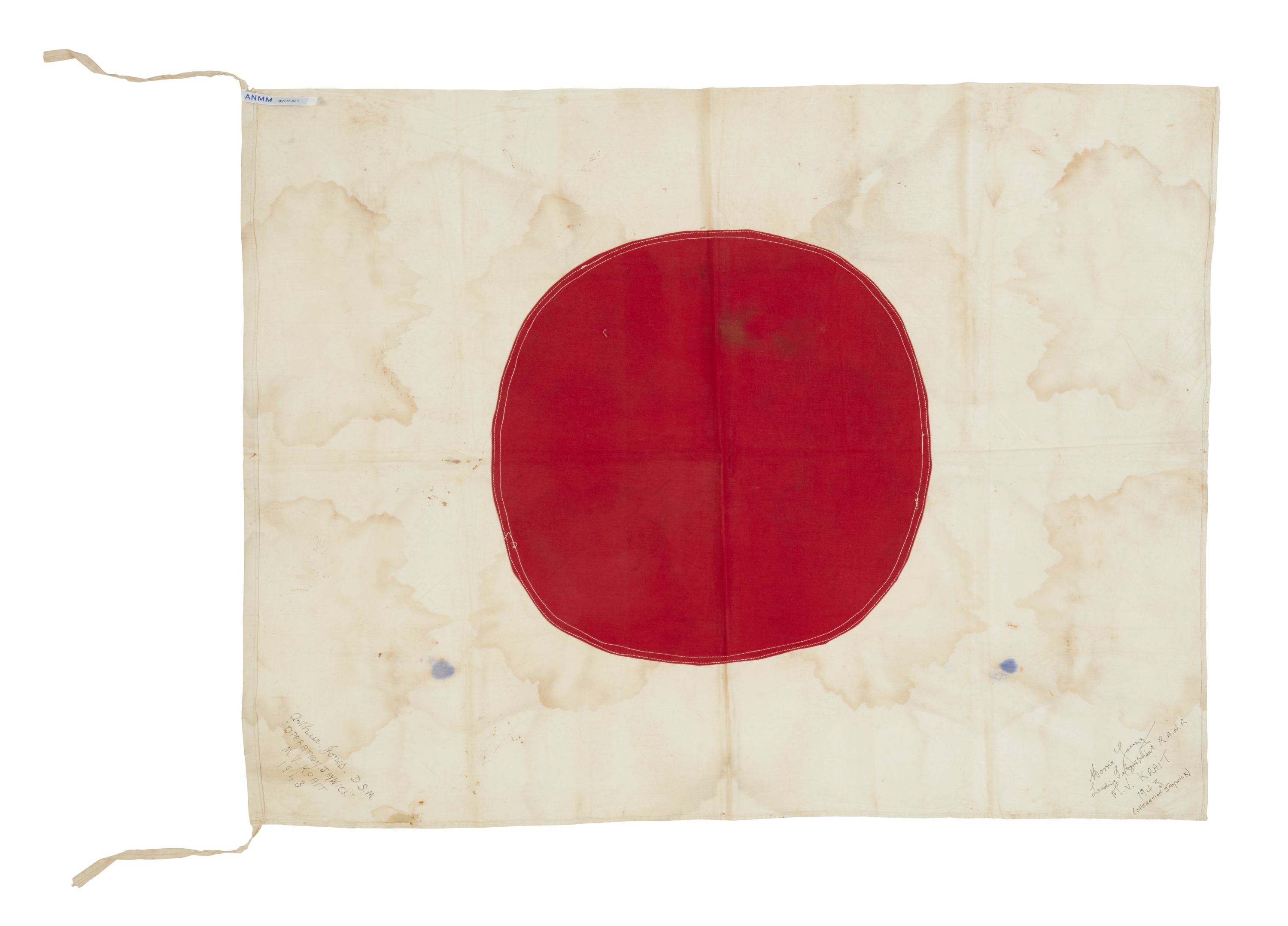Japanese ensign - Off white flag with a large red circle in the middle. There are small hand written signitues on the lower left and right corners.