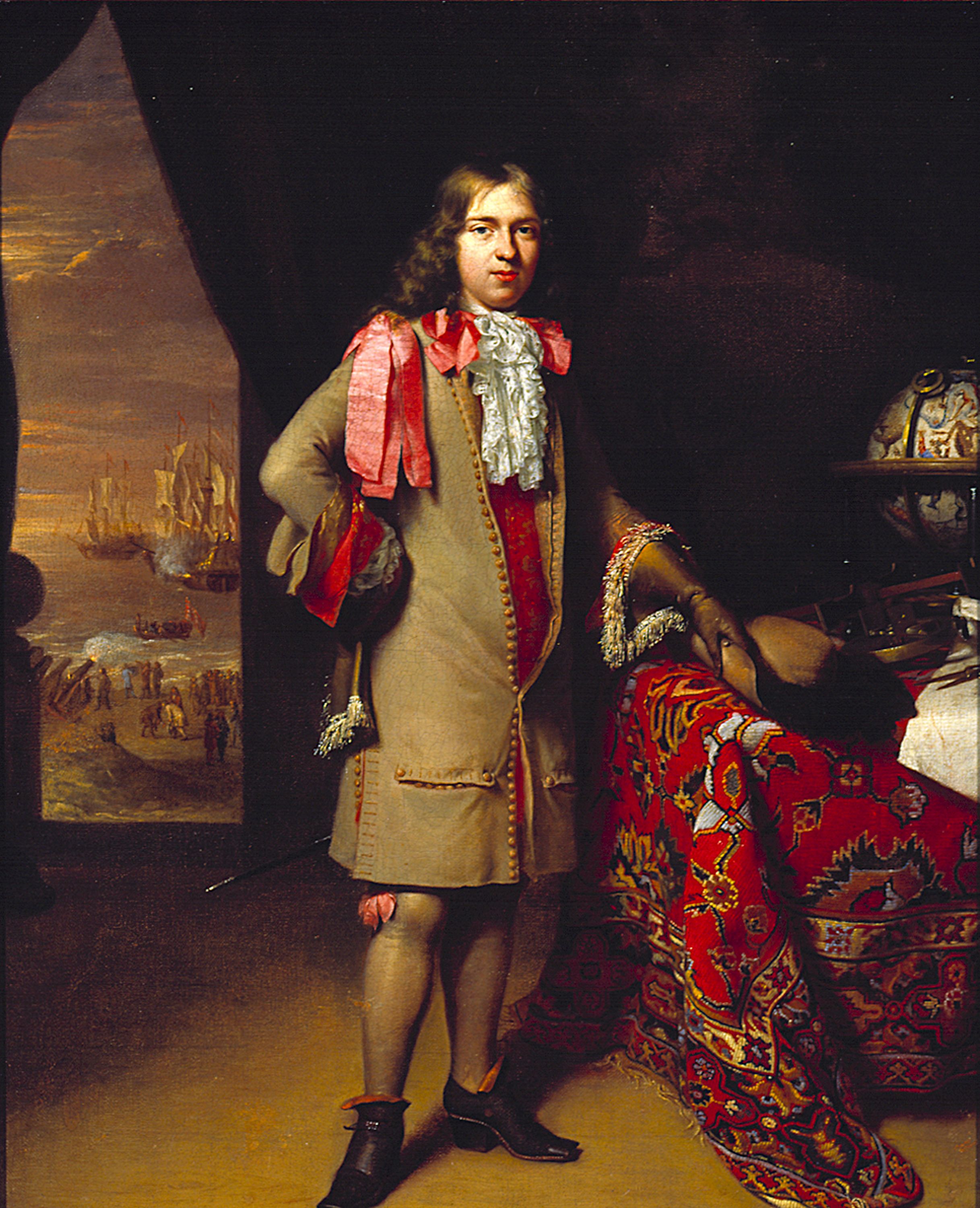 A portrait of a man with long hair standing in the middle, wearing a brown coat with red ribbons. To the left there is an open door, showing boats in the background, and to the right is a globe. 