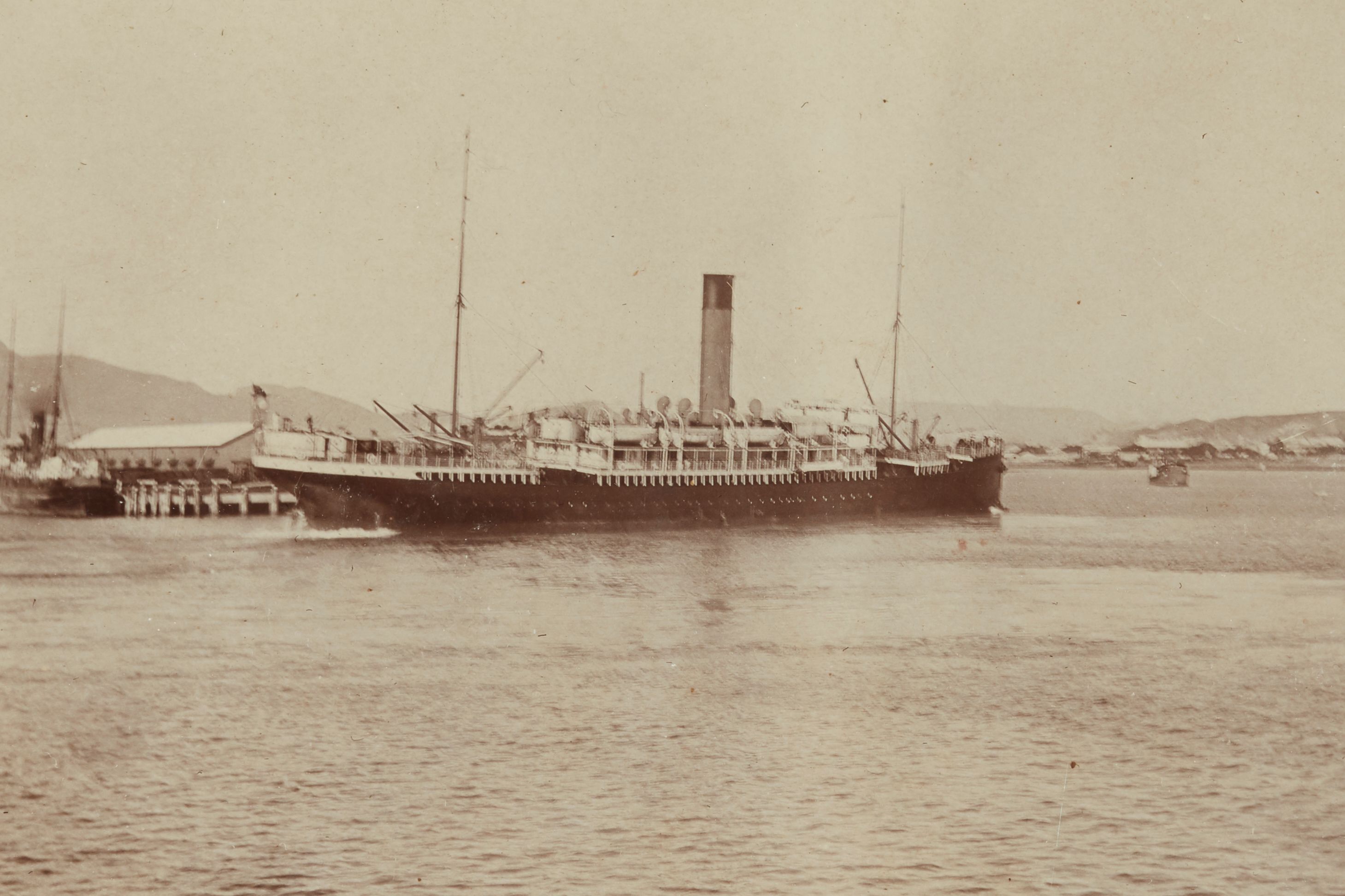 Black and white photograph showing a boat.