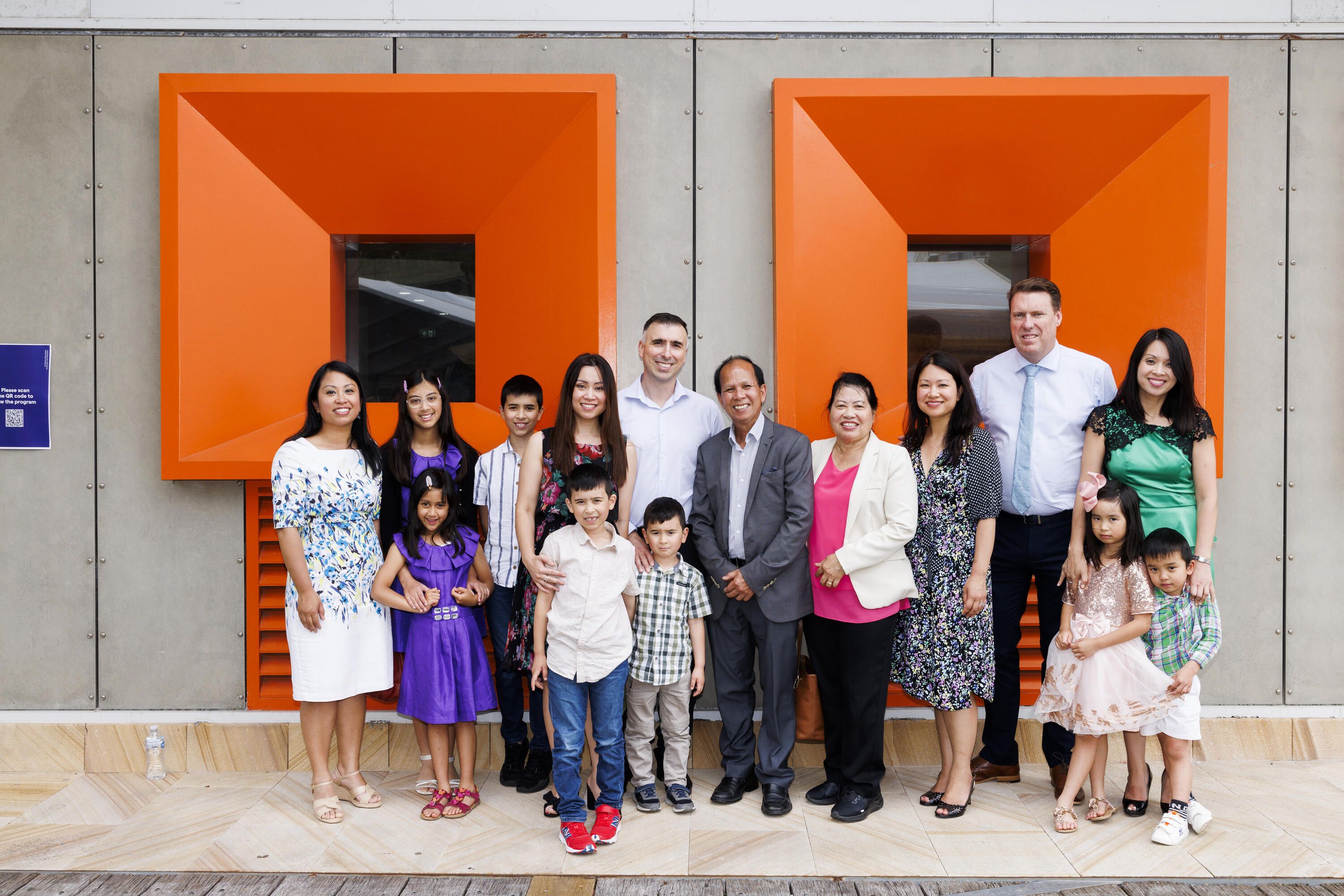 Large group of people, both adults and children.