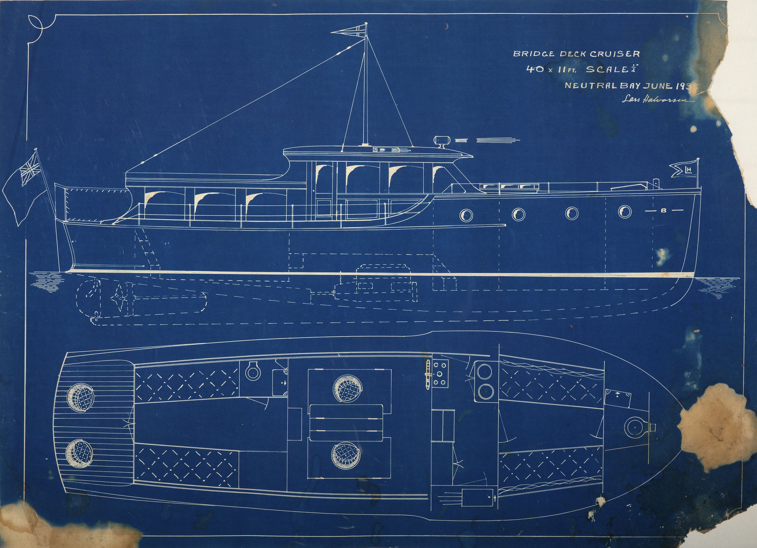 Blueprint with white drawing of the outline of a boat. 