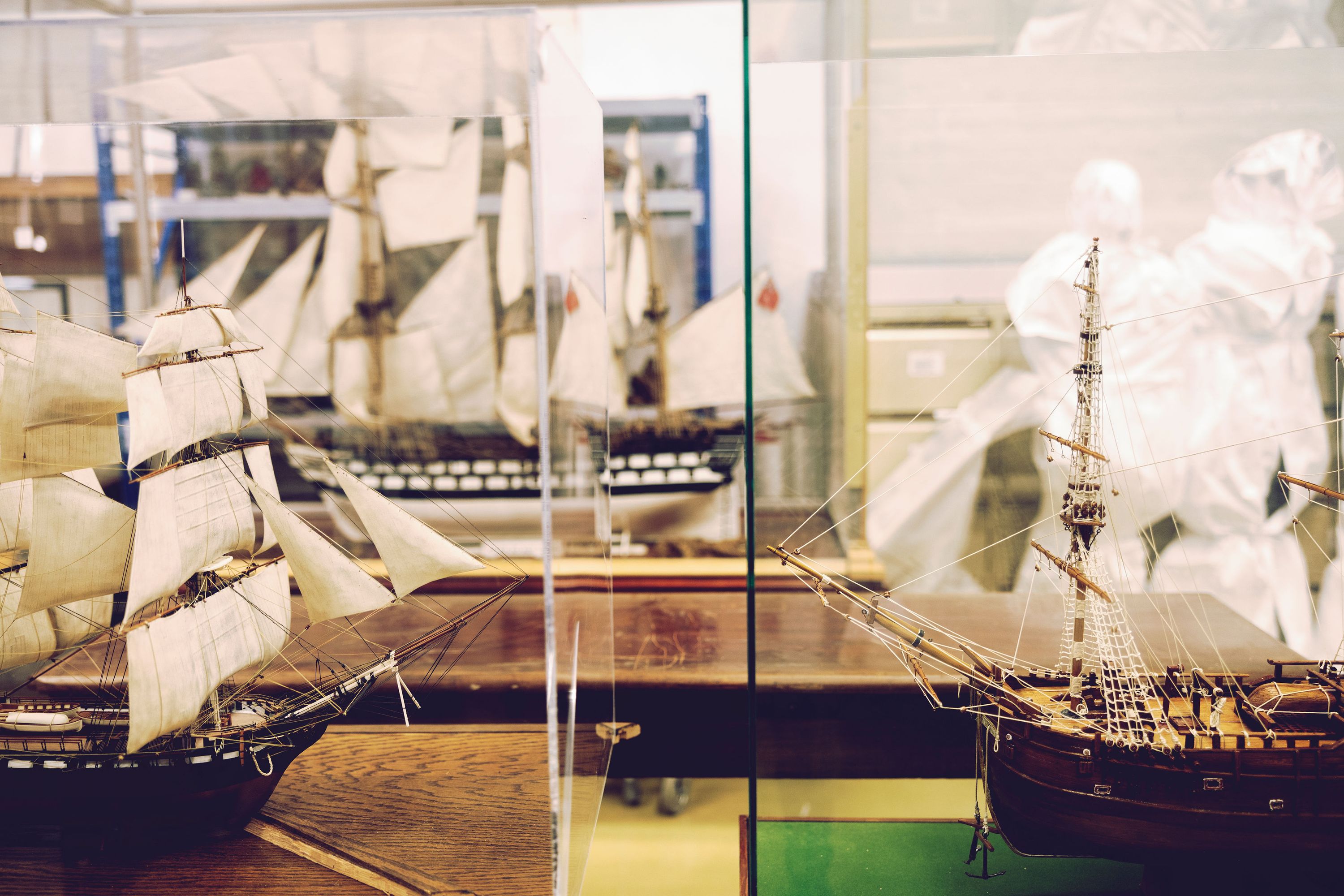 A photo showing models of tall ships