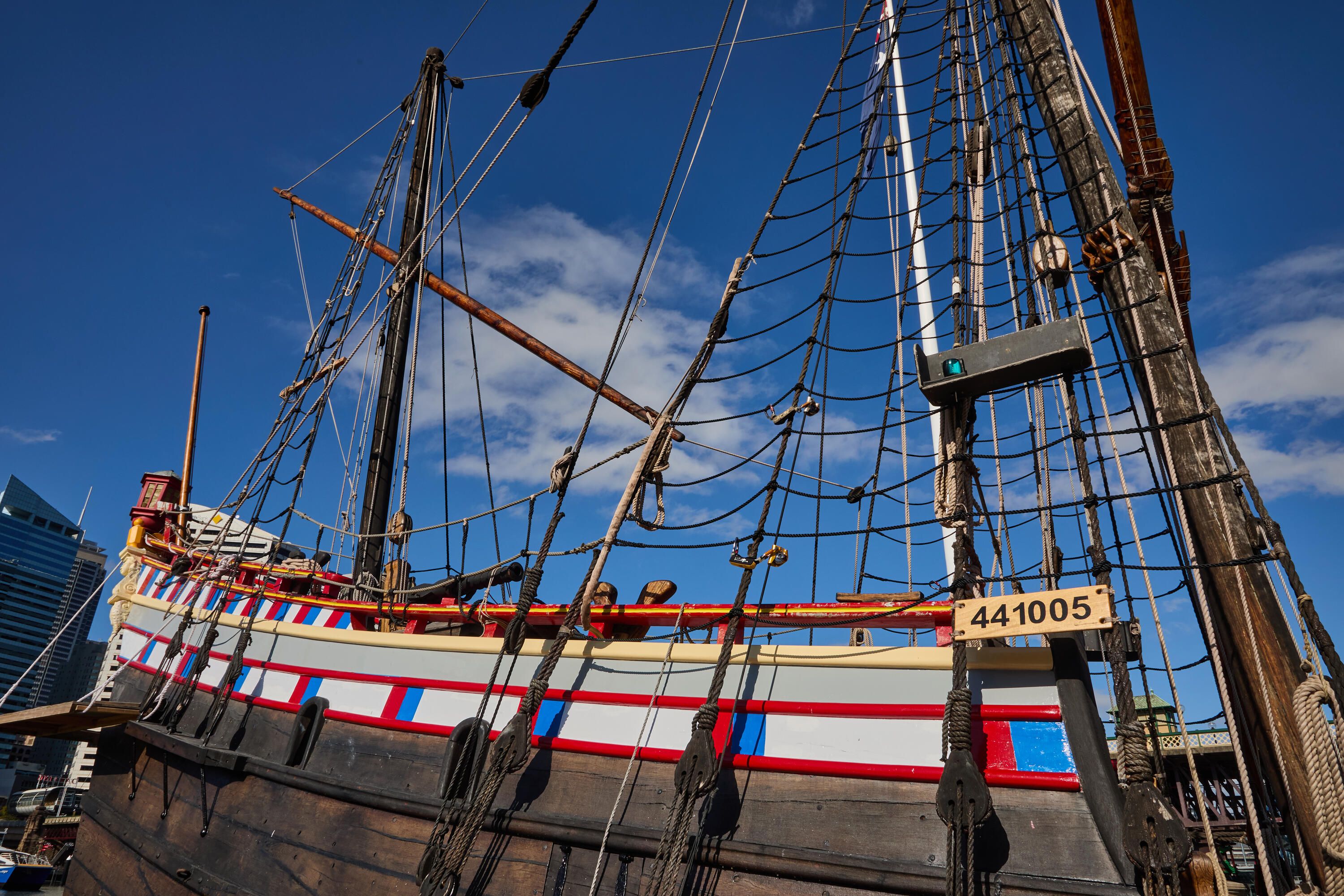 Photo of the side of a replica tallship.