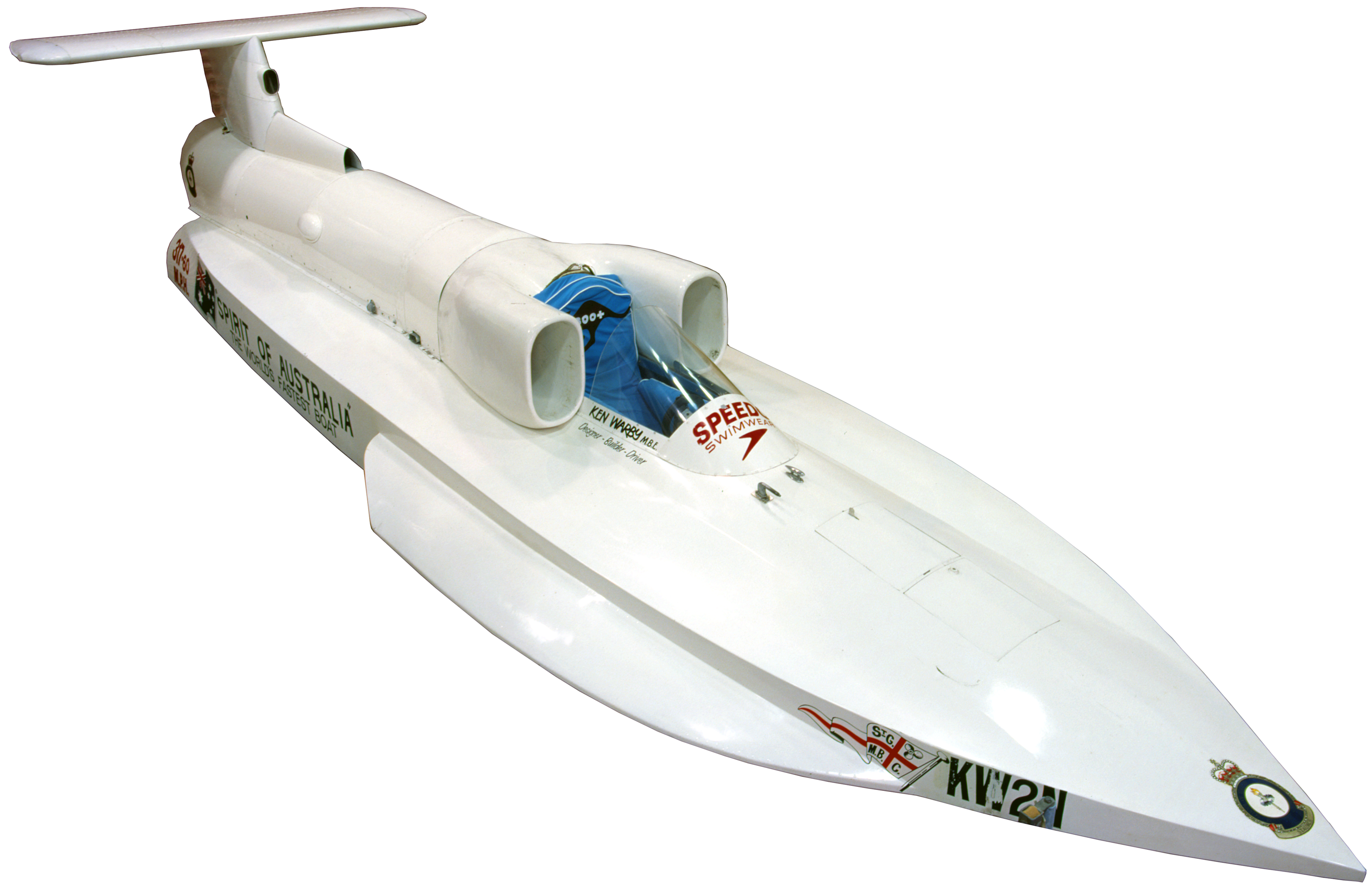 Photo of a long, sleek white boat, with a single seat.