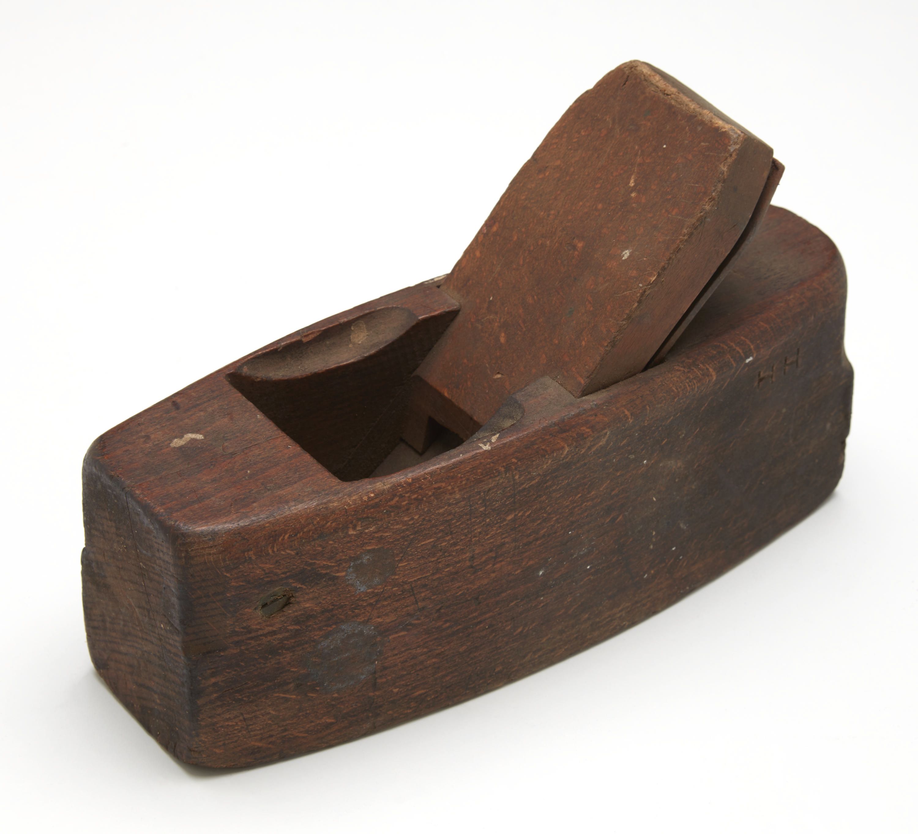 Photo of a brown wooden tool on a white background