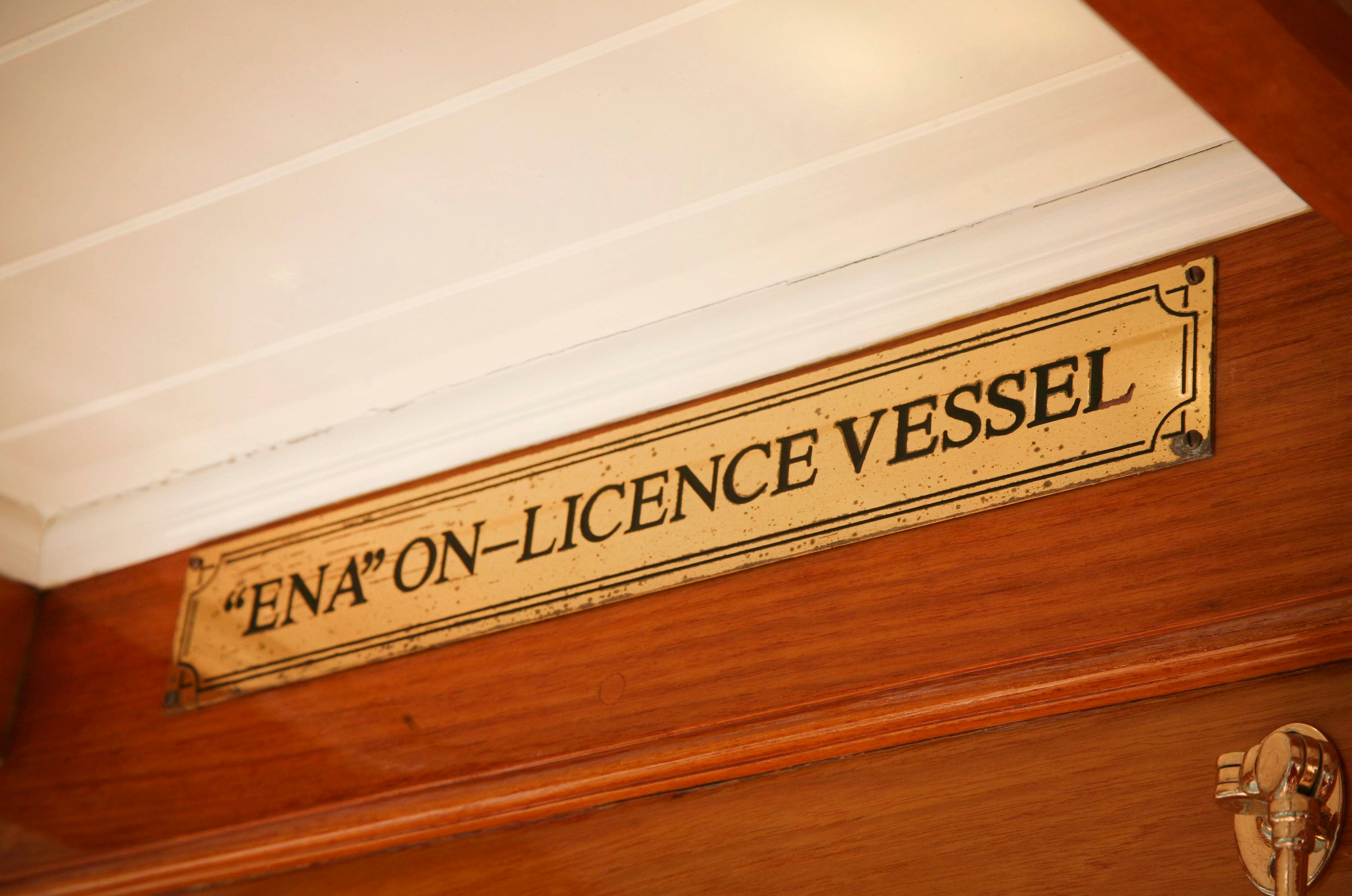  Interior close up view showing brass sign saying "ENA" ON-LICENCE VESSEL