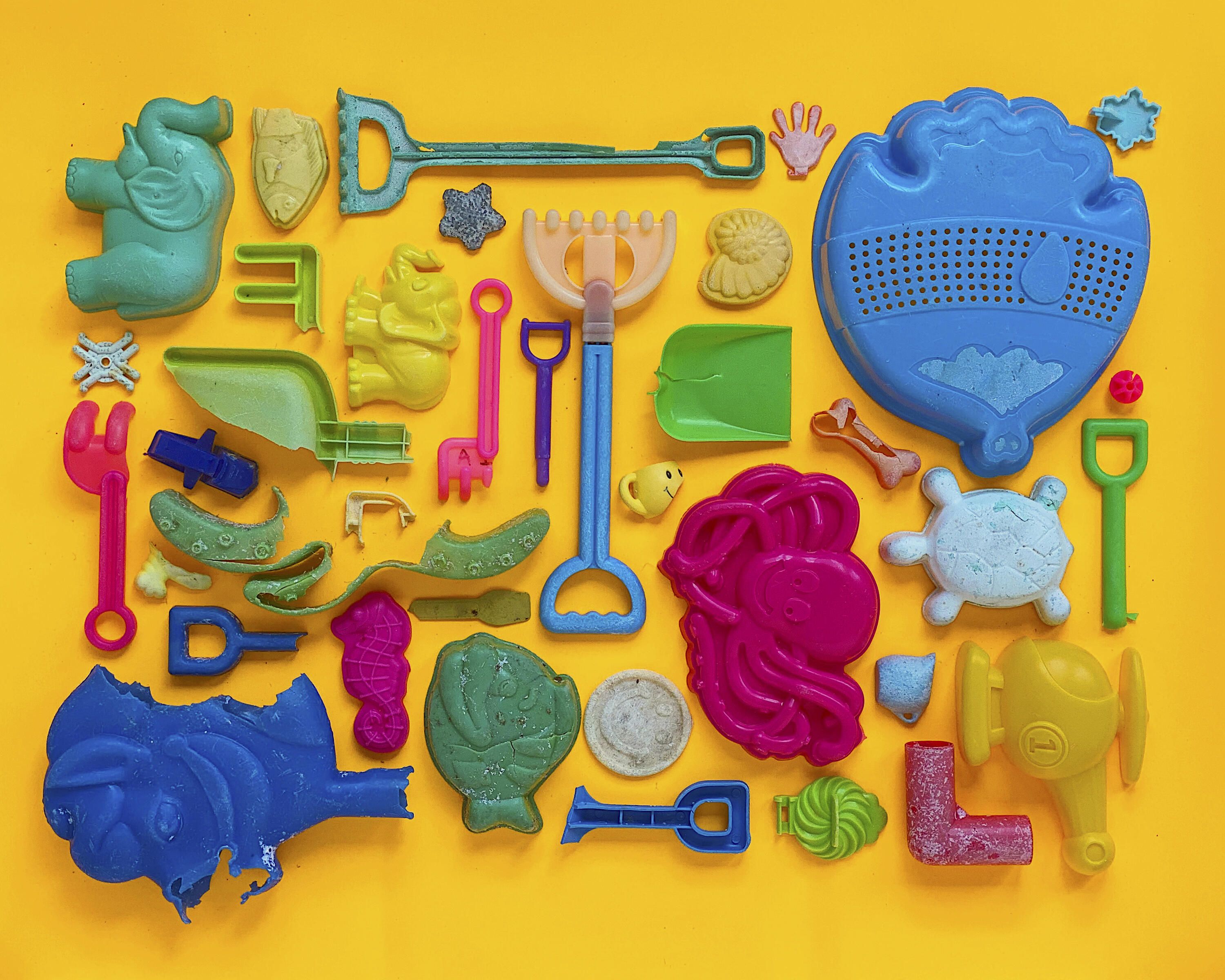 A group of colourful plastic toys found on the beach