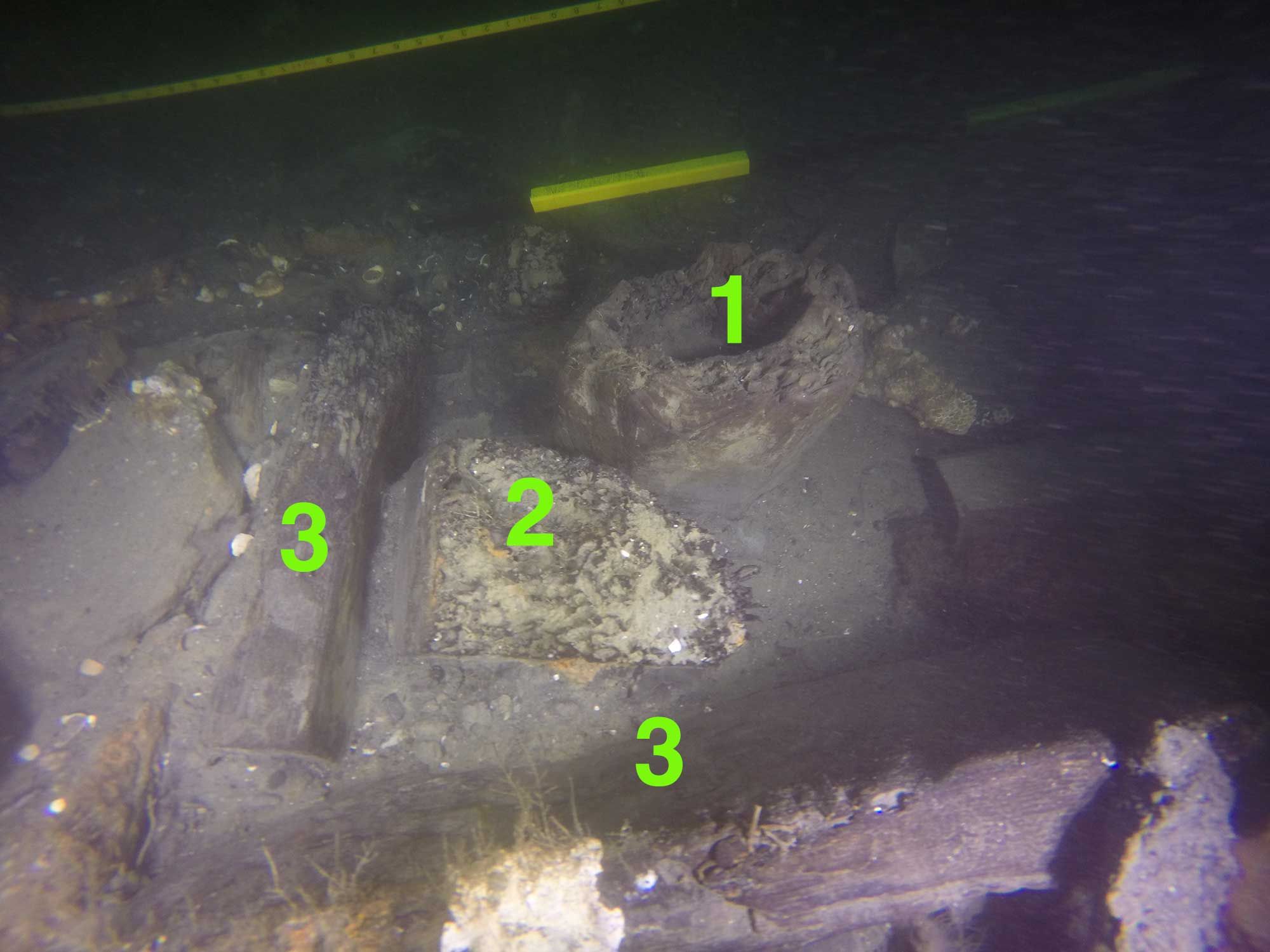 RI 2394’s surviving starboard bilge pump shaft and surrounding pump well. Numbers indicate: 1. Pump shaft stump, 2. Dislodged corner post, 3. Planks that form the corner of the pump well.
