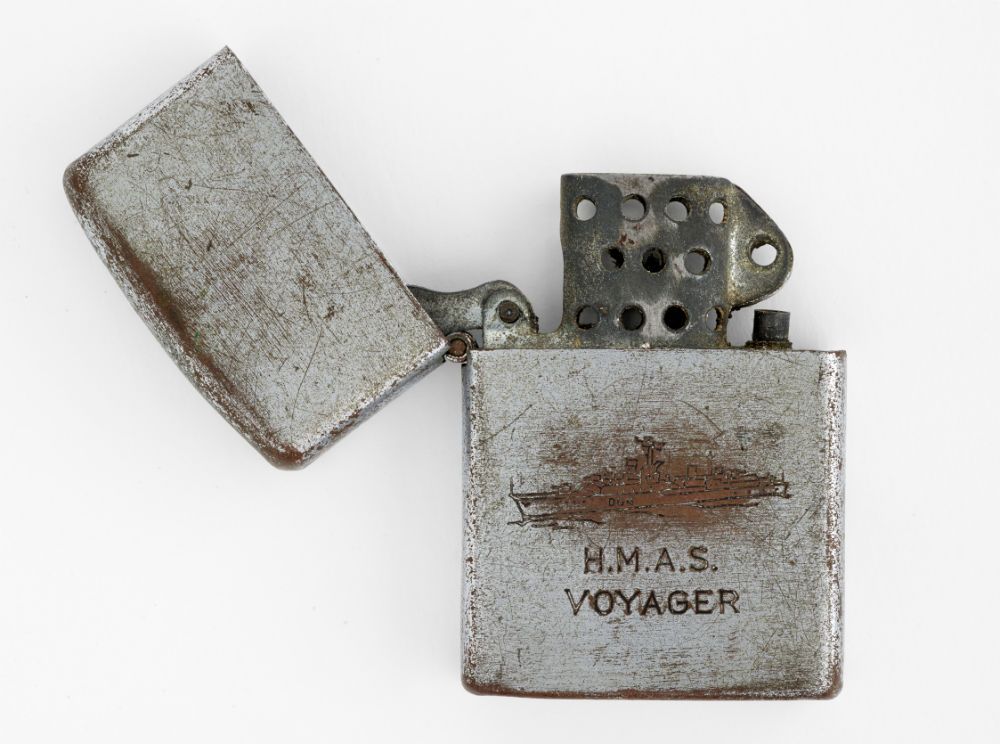 Cigarette lighter. Penguin. HMAS Voyager cigarette lighter. c.1964