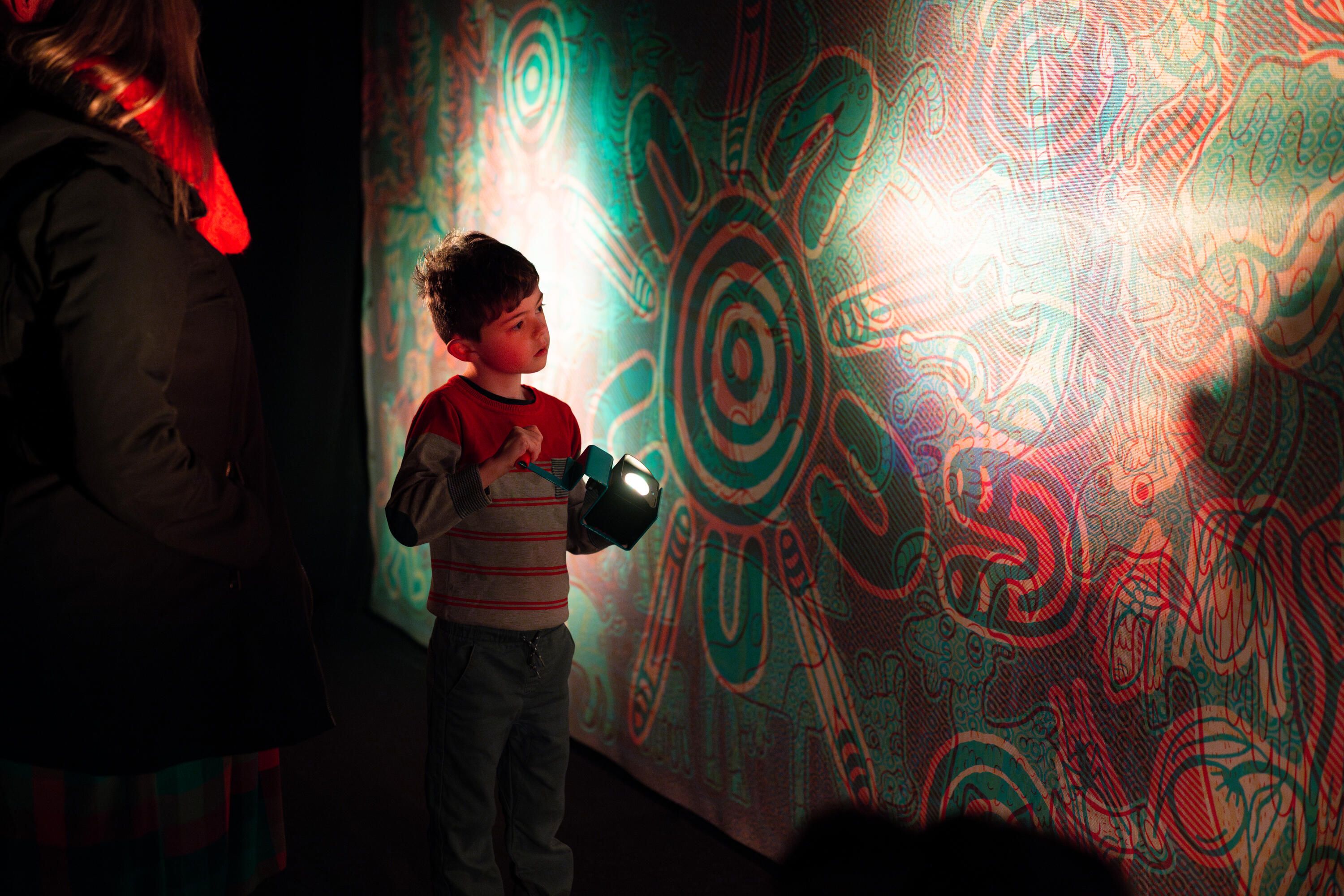 Child holding a light