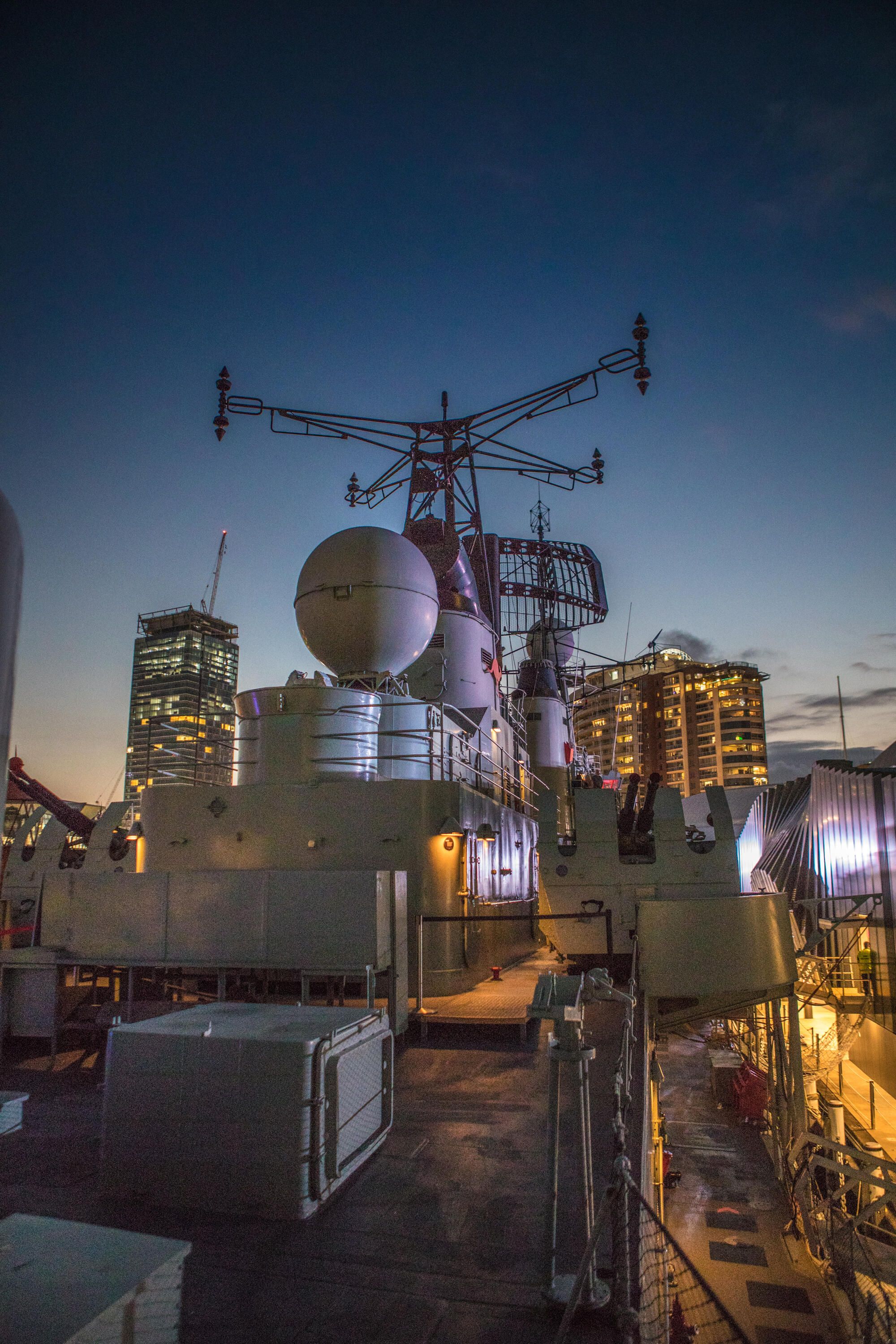 Deck of Navy destroyer HMAS Vampire at dusk.