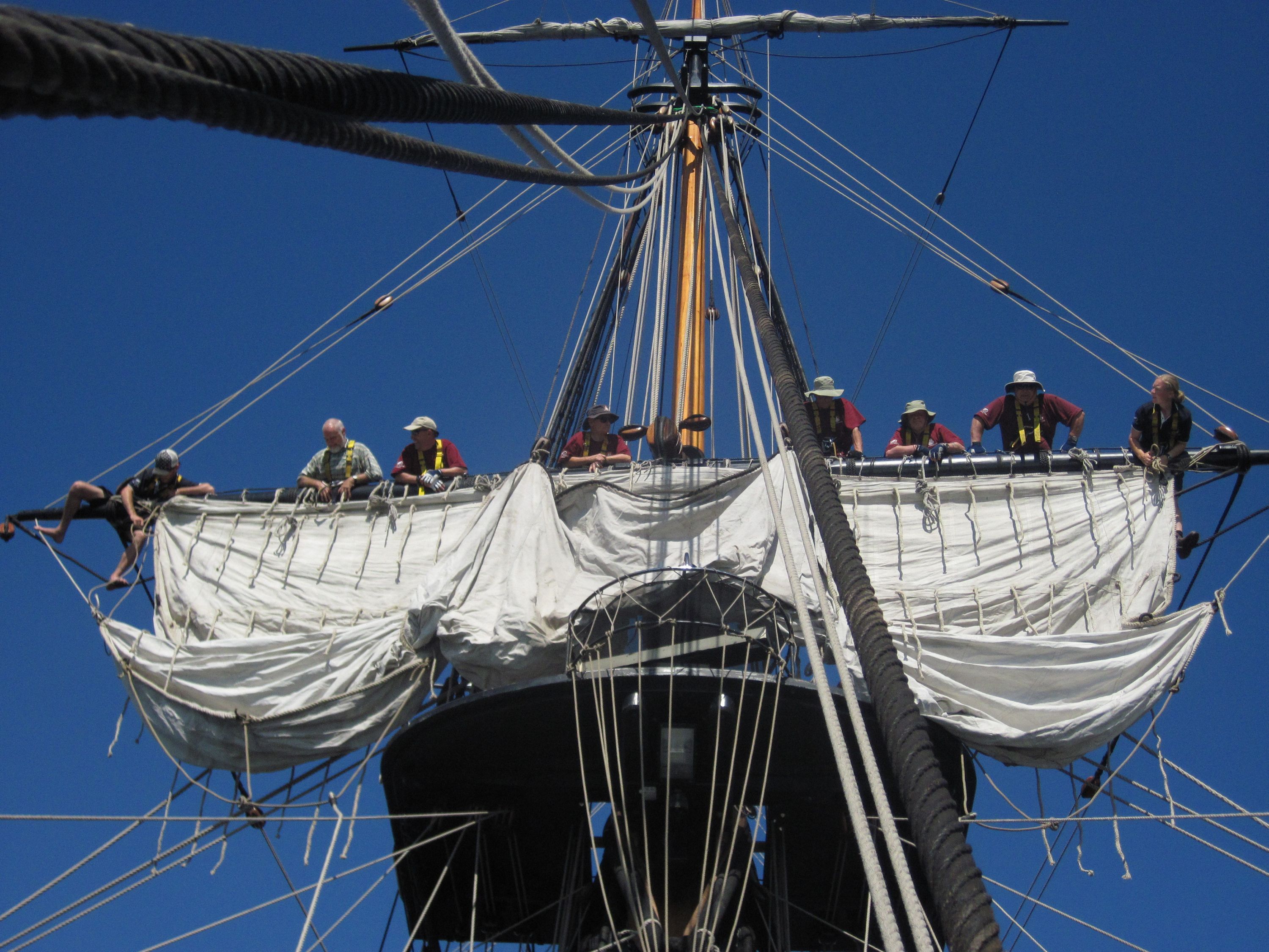 Image showing the crew on HMB ENDEAVOUR replica 2010- on the rigging furling / unfurling sails.  This image featured in the ANMM exhibition '20 Years - a snapshot' which celebrated the museum's 20th anniversary.