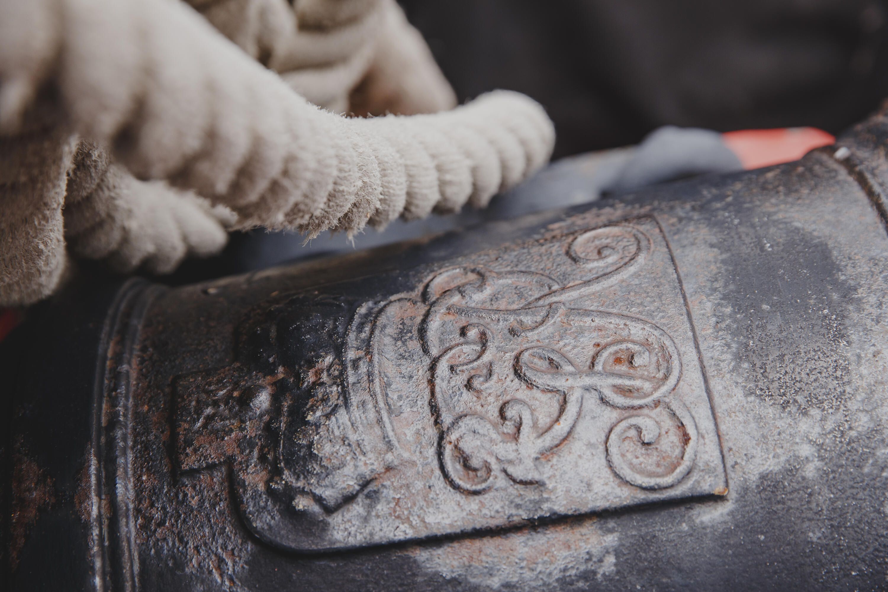 Close up photo taken on a tall ship showing a A close-up of one of the ship's guns / cannons with rope slung above
