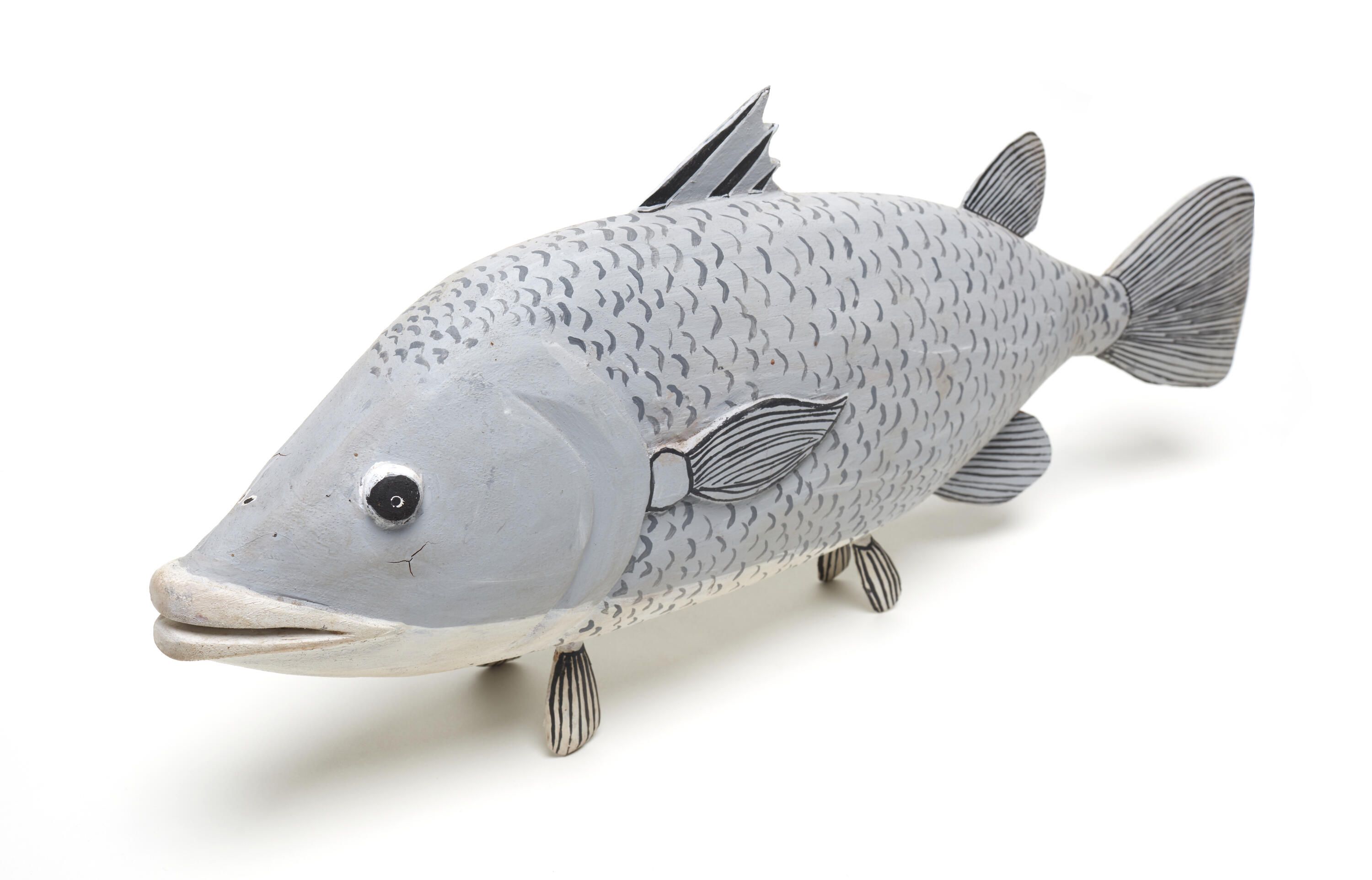 Pale grey wooden painted fish.