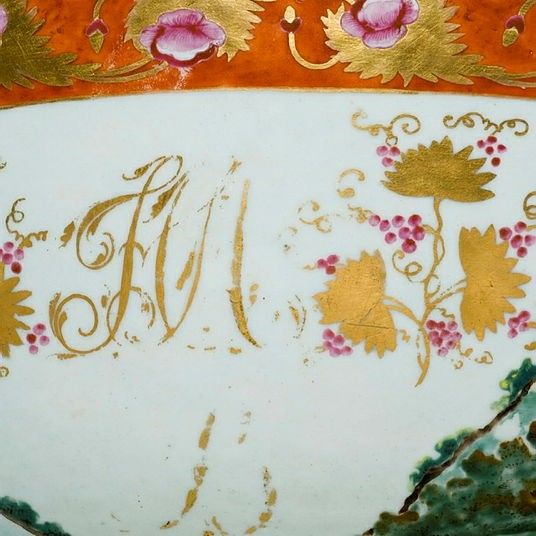 A close up photograph showing gold lettering and leaf details.
