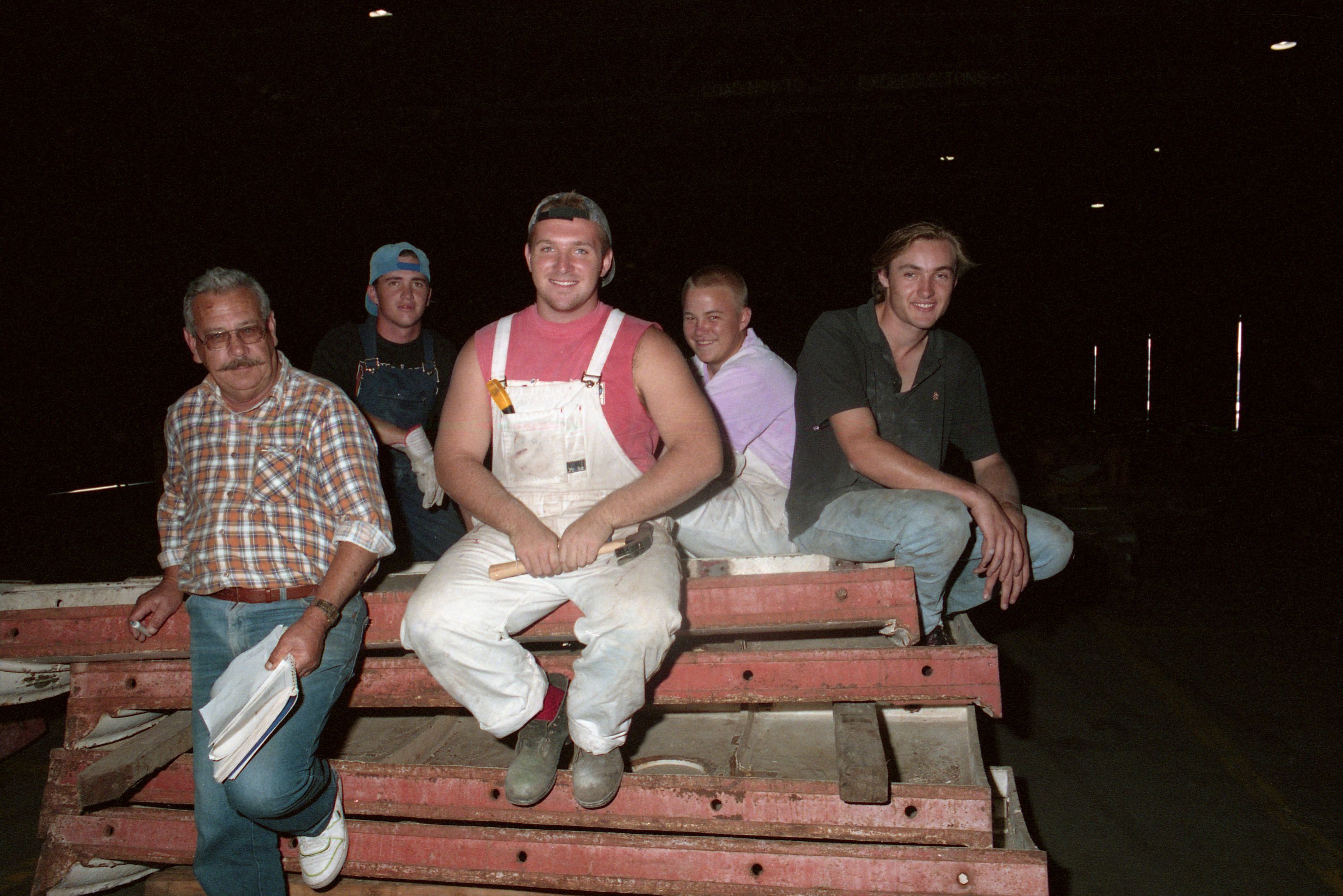 group of men, mostly young students and one older man.