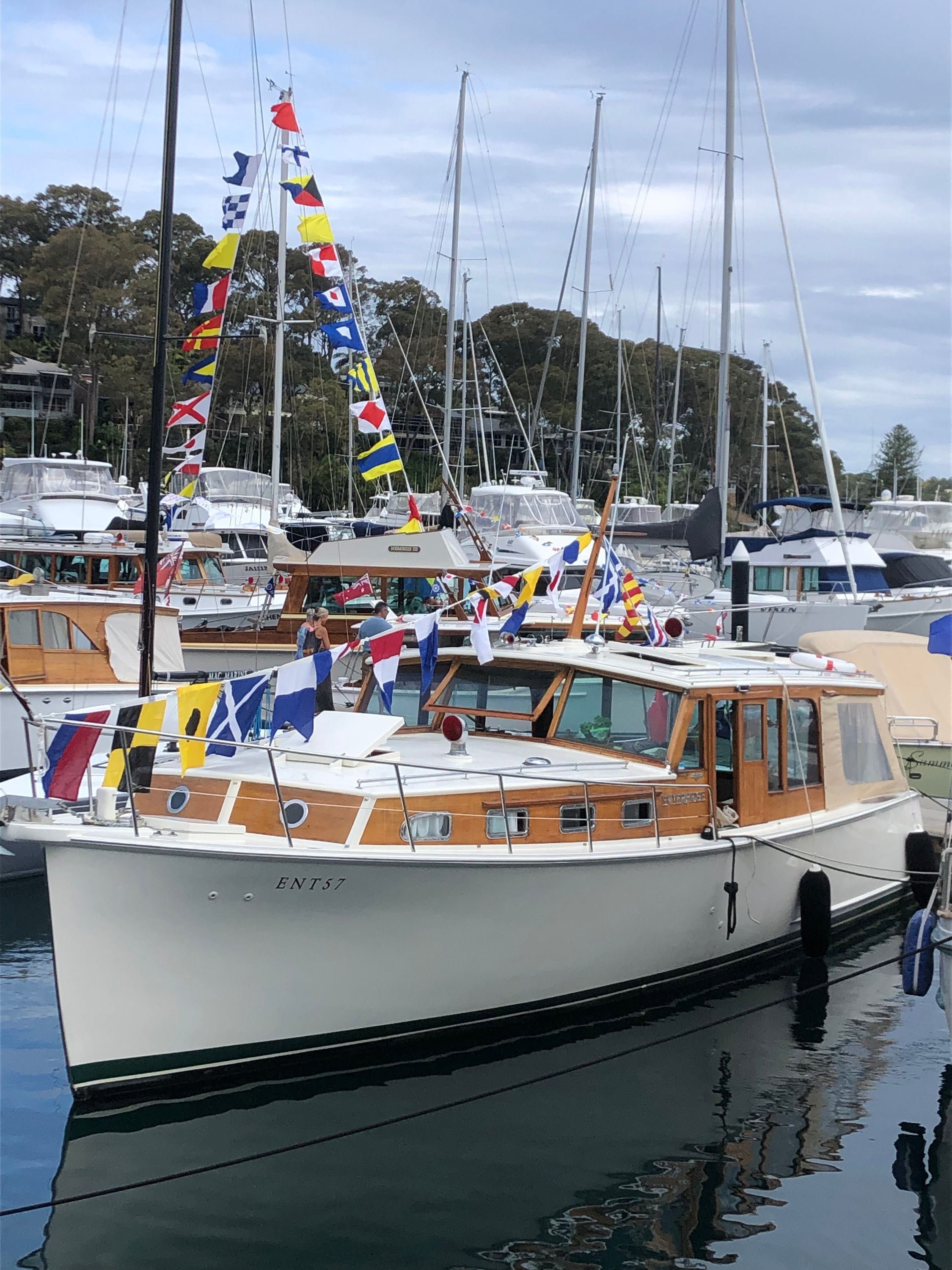 Photo of a moored boat decorated with flags. 