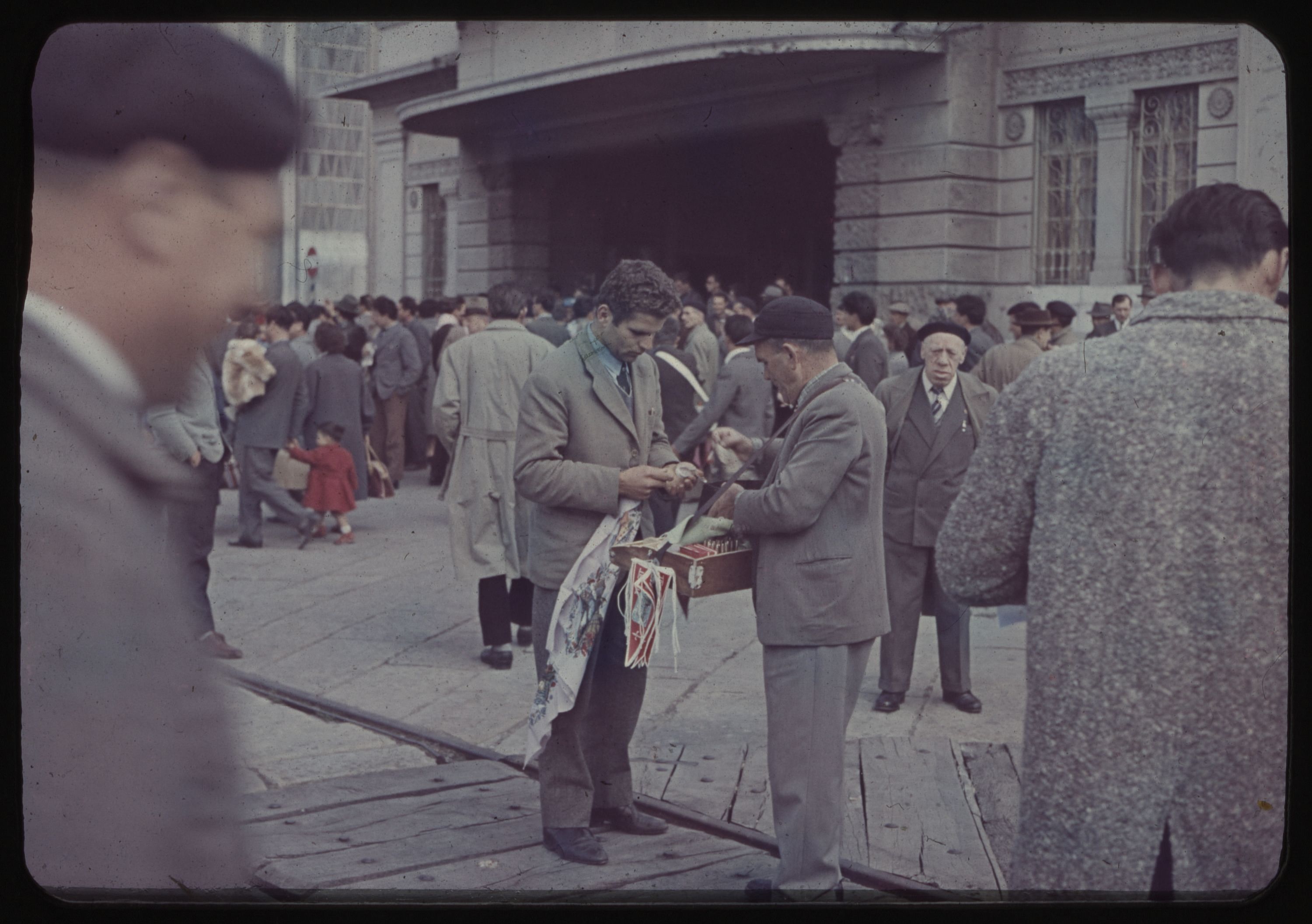 Man purchasing from street vendor on wharf