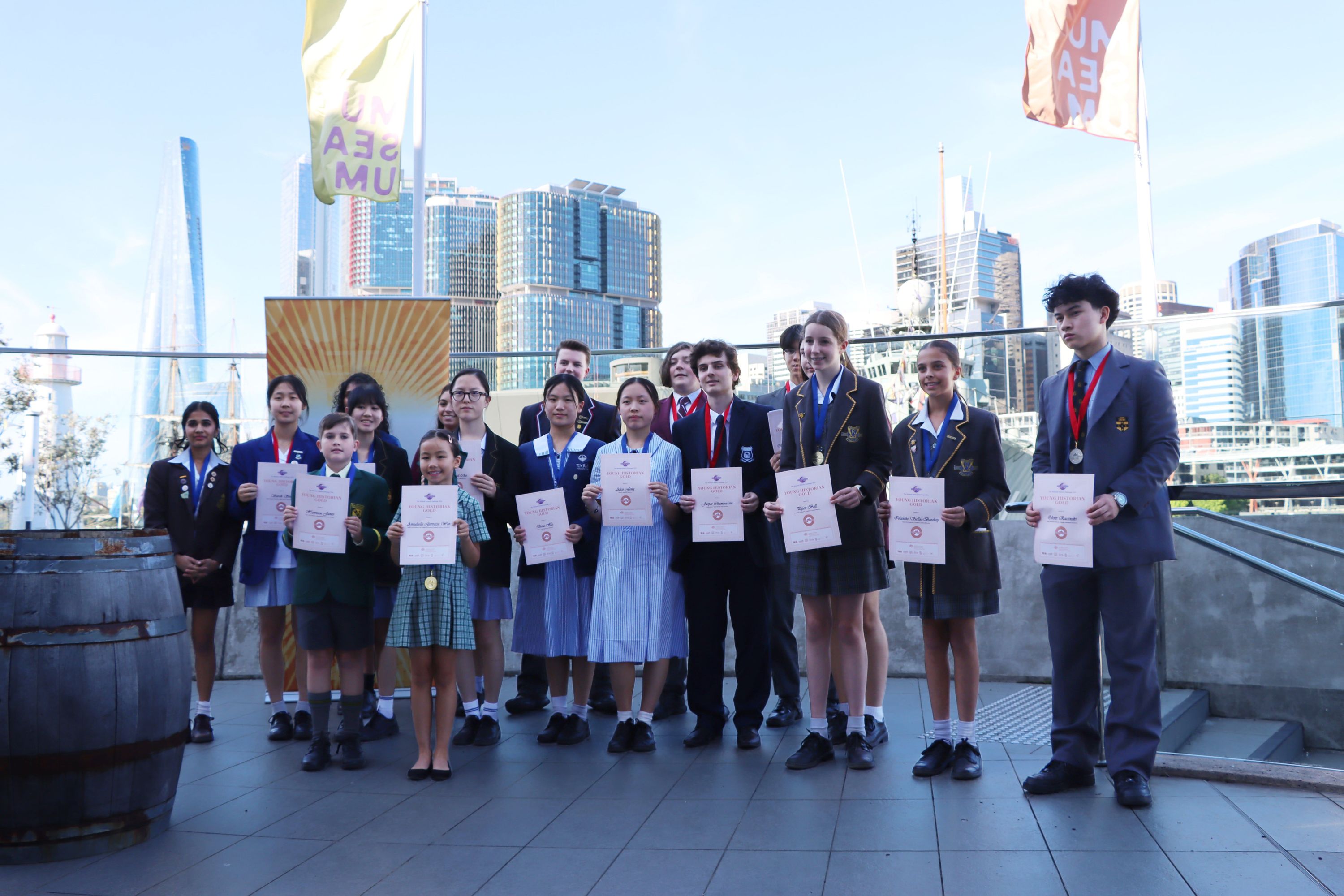 Photo showing a group of school students holding certificates. 