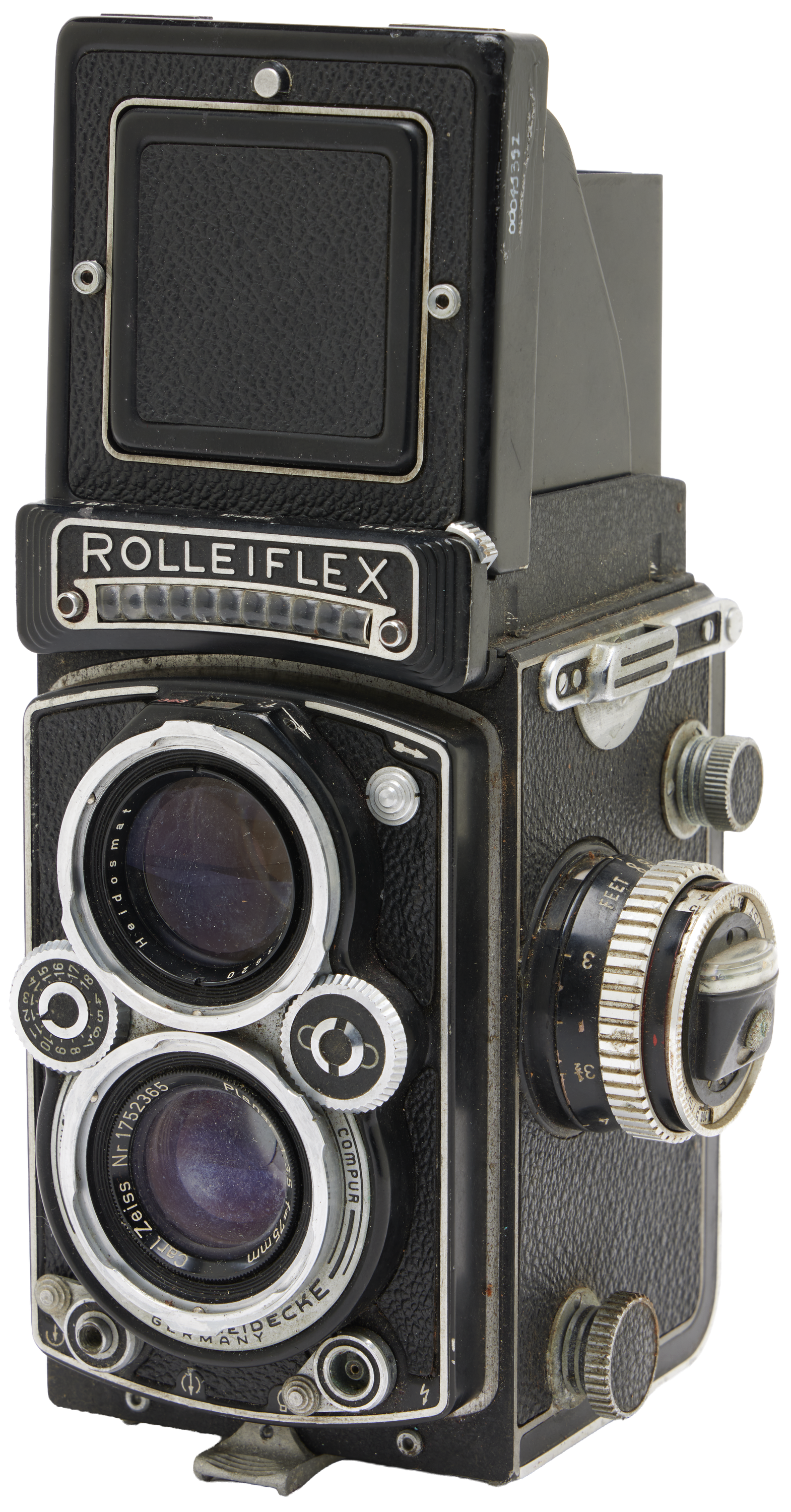 Photograph of an old camera with a black, rectangular shape.