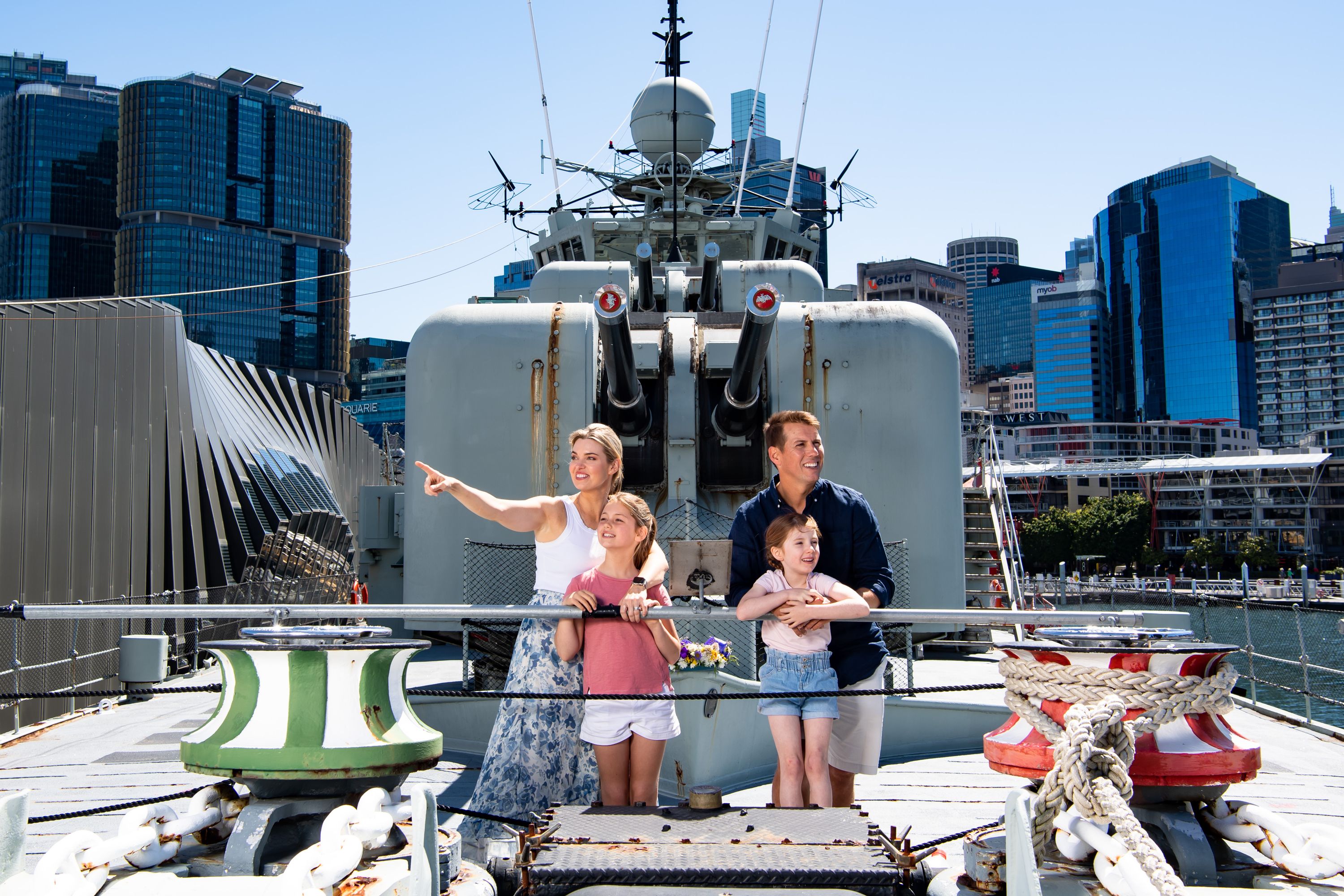 Photograph showing a family on the deck of a Navy destroyer. 
