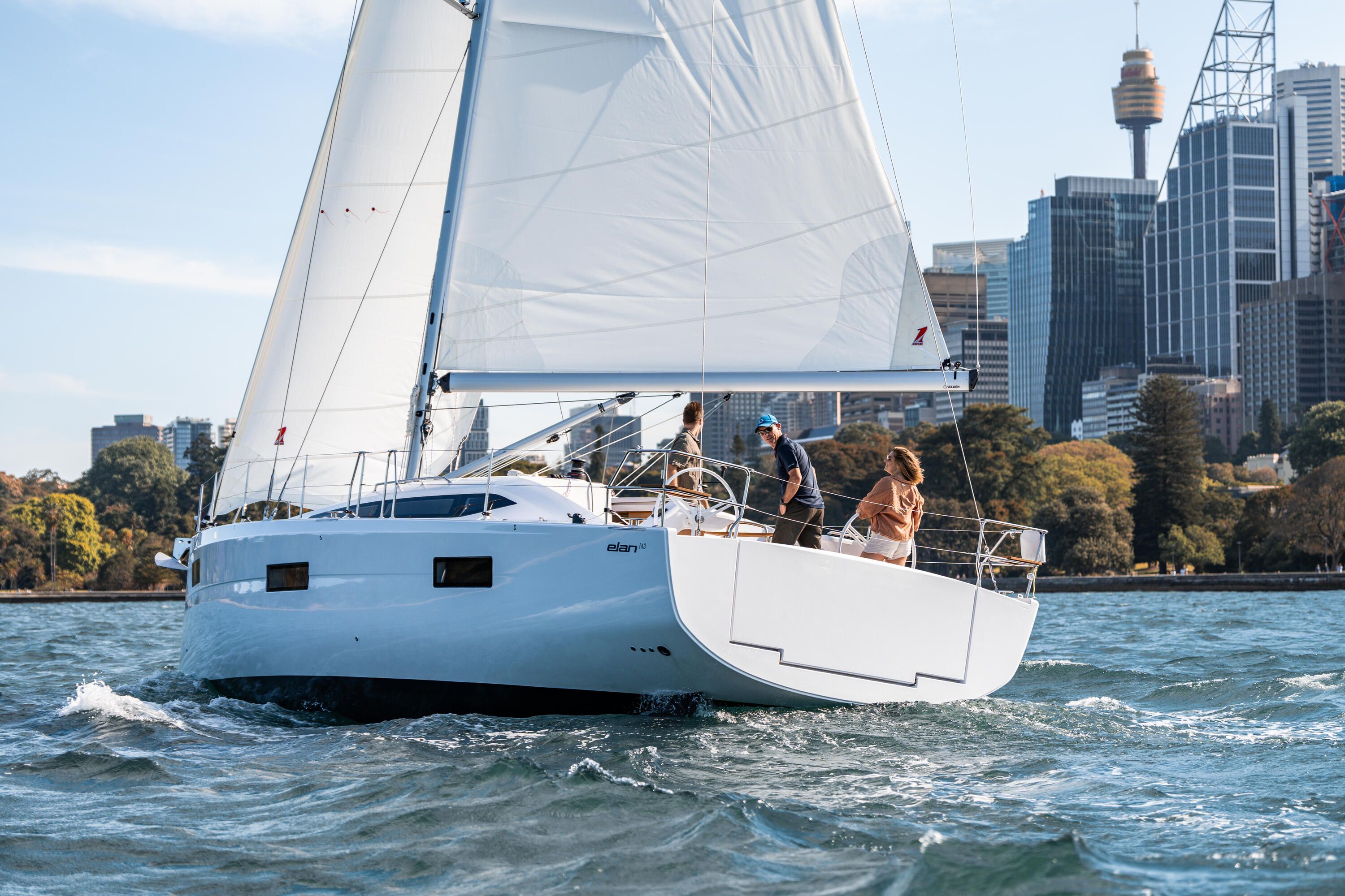 Close up photo showing people on a sailing boat. 