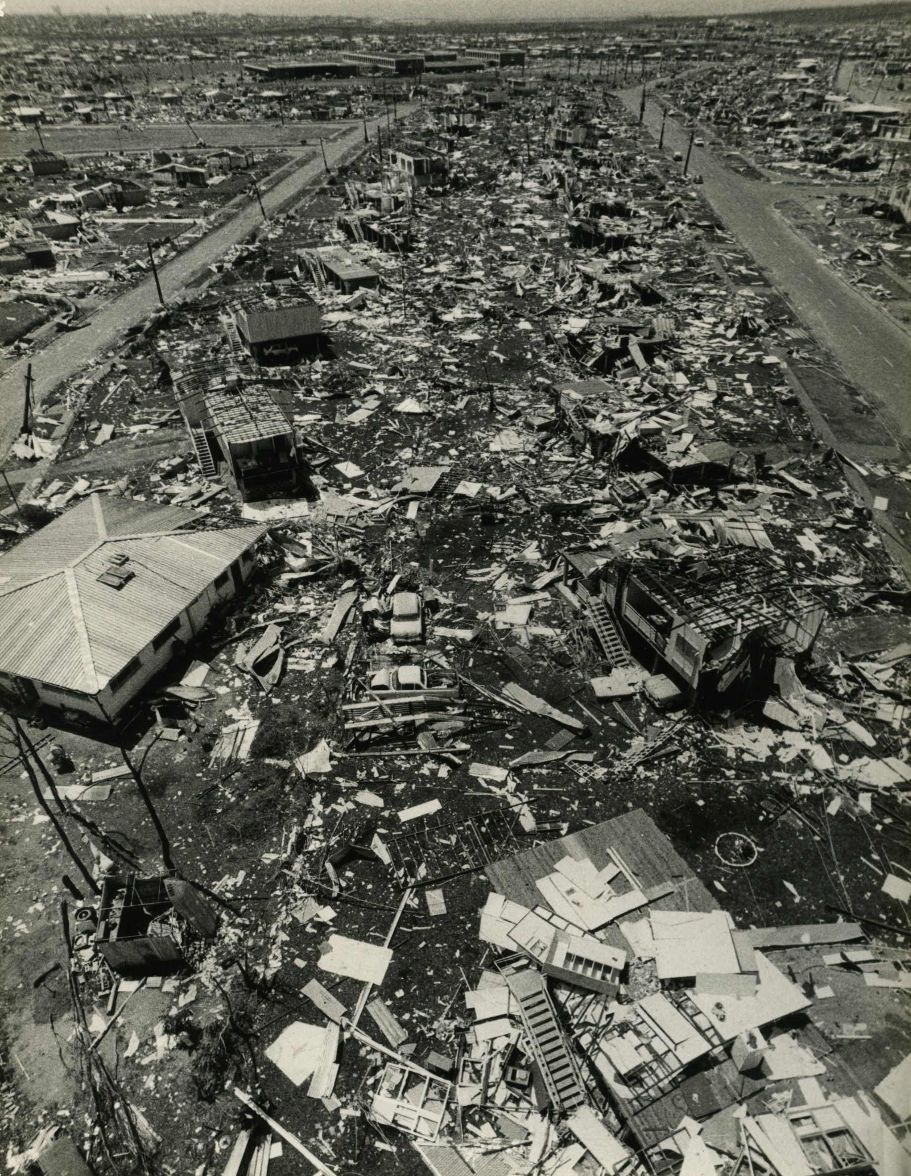 Black and white photograph showing the damage in the northern suburbs of Darwin