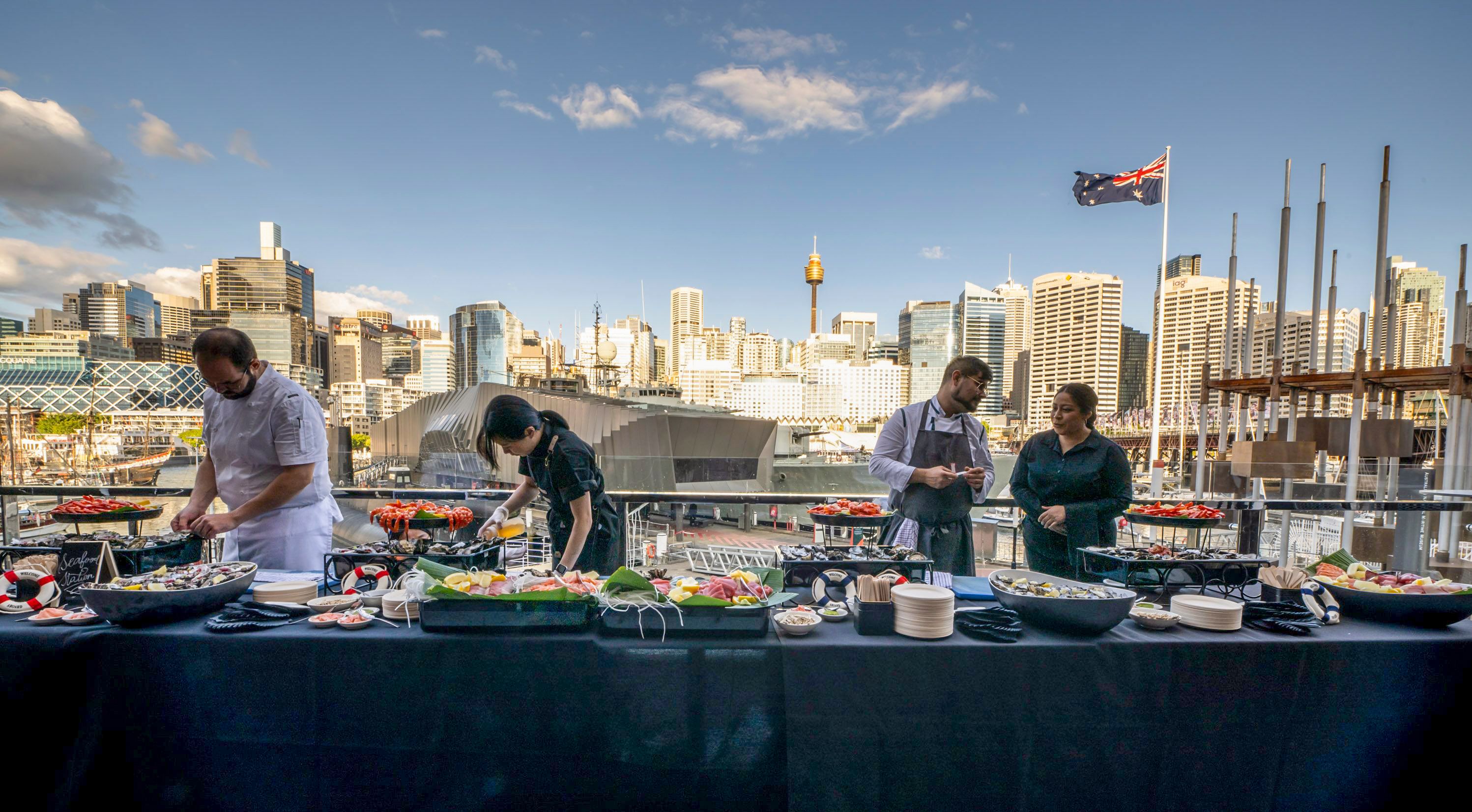 Event space with caterers at a long banquet table
